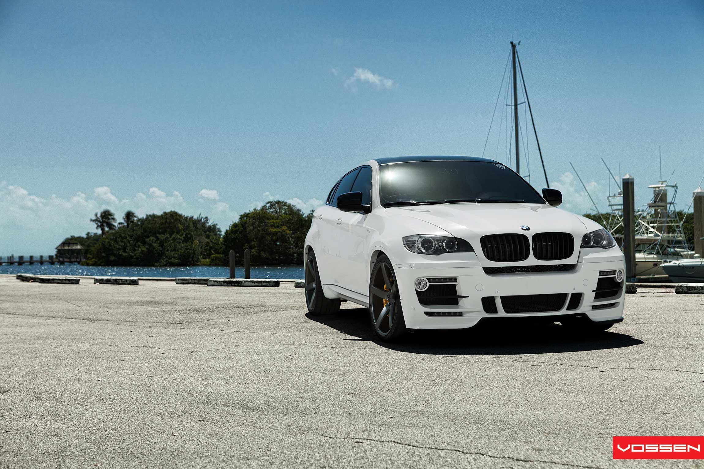Custom Front Bumper with Fog Lights on White BMW X6 - Photo by Vossen