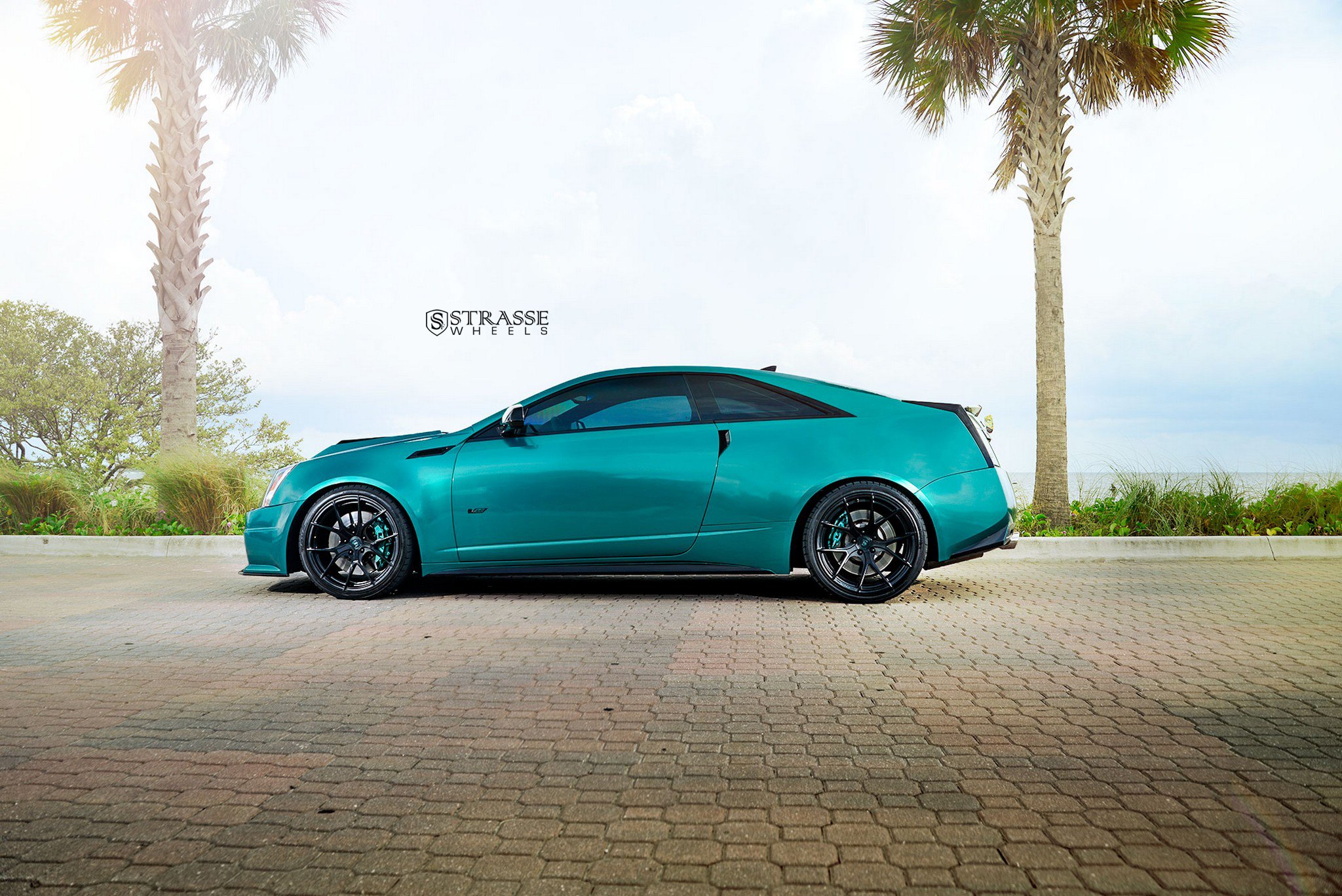 Aftermarket Side Skirts on Green Cadillac CTS - Photo by Strasse Forged