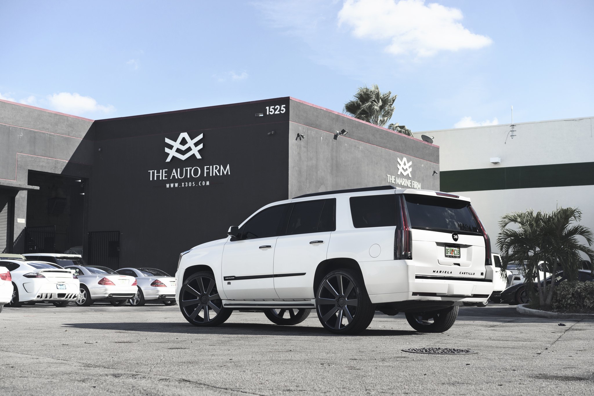 White Cadillac Escalade with Aftermarket Rear Bumper Cover - Photo by DUB