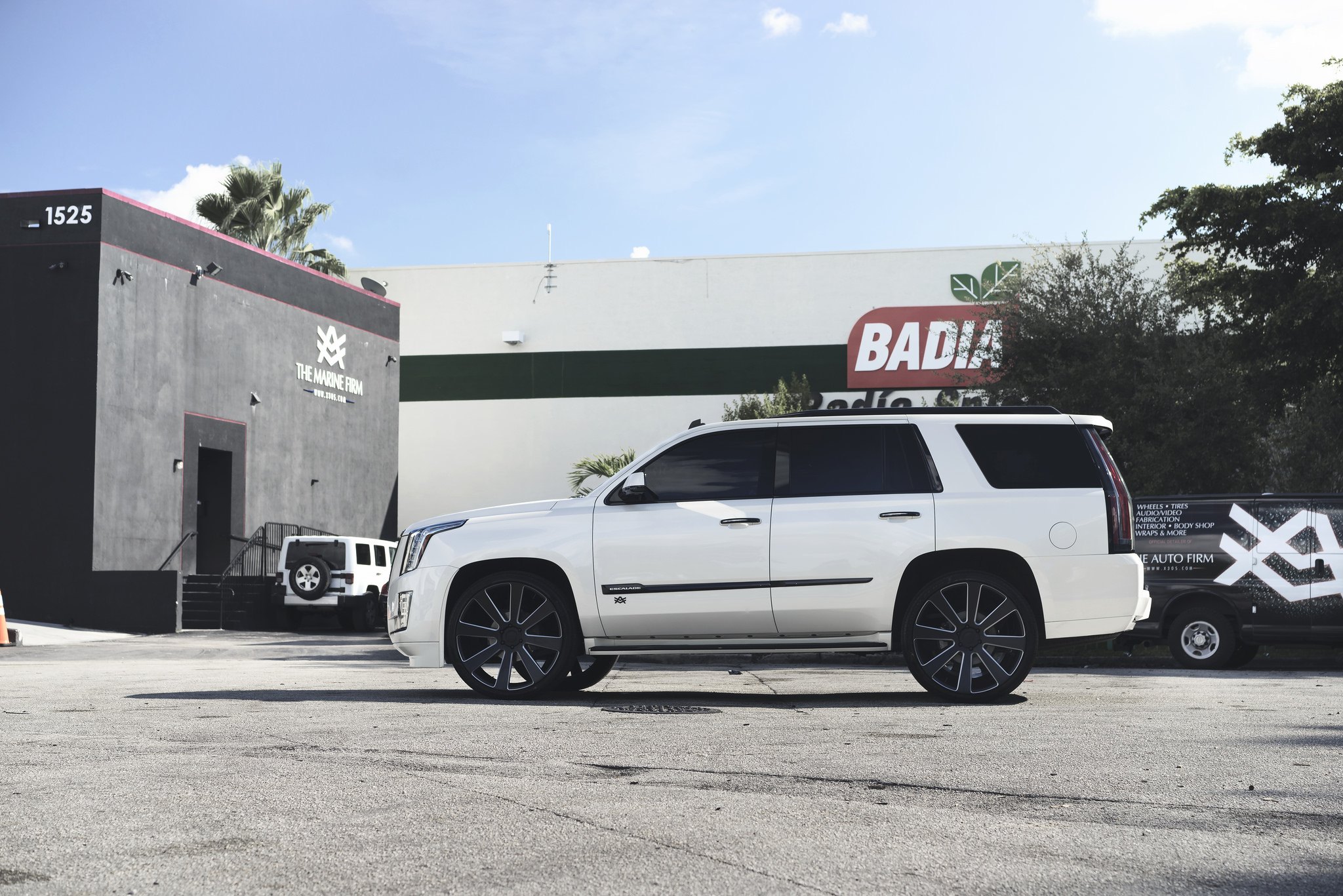 Lifted White Cadillac Escalade on Black and Milled DUB Wheels - Photo by DUB