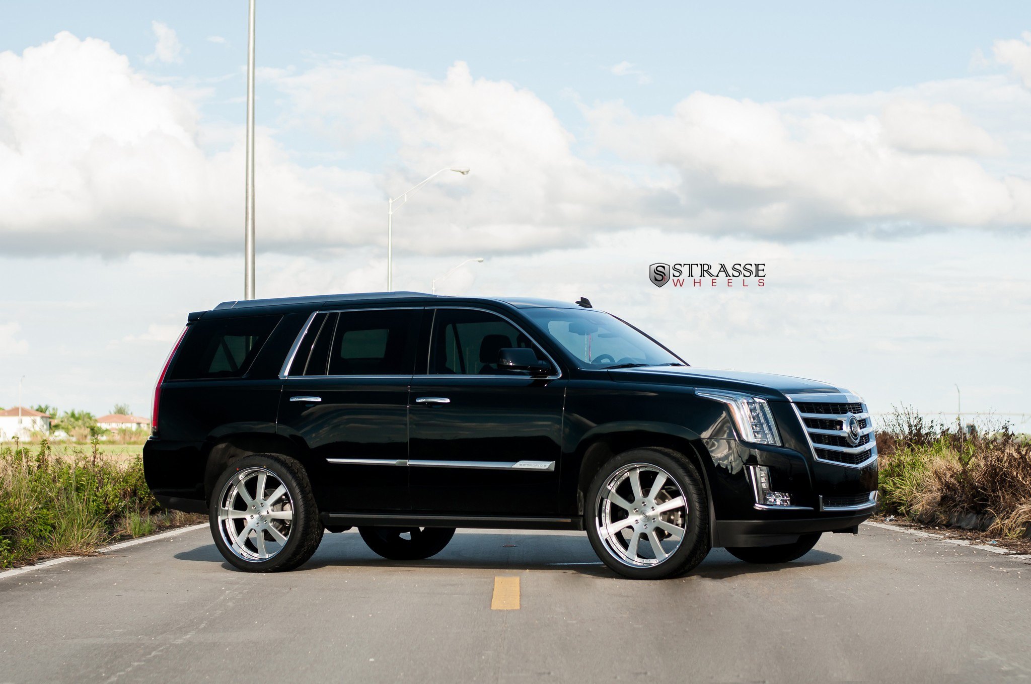 Retractable Running Boards on Black Cadillac Escalade - Photo by Strasse Forged