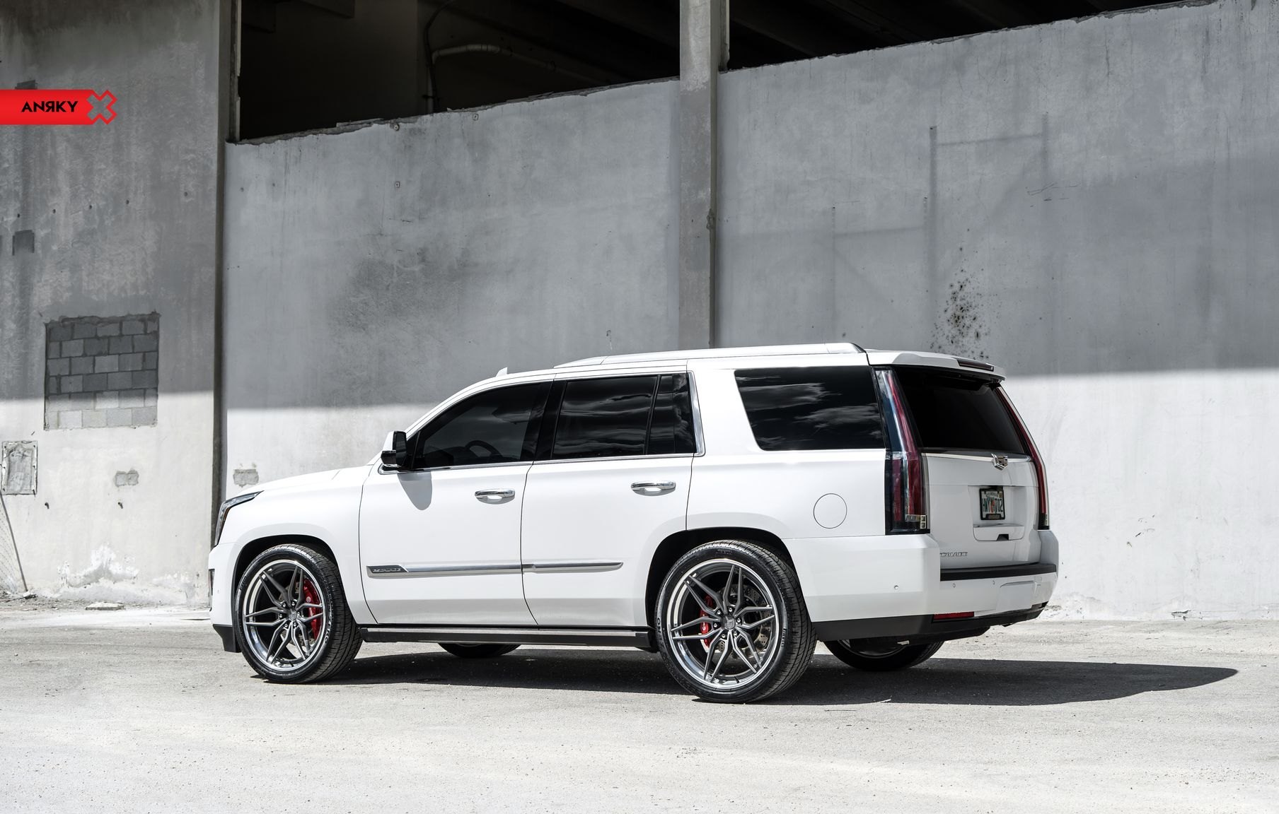 White Cadillac Escalade with Aftermarket Running Boards - Photo by Anrky Wheels