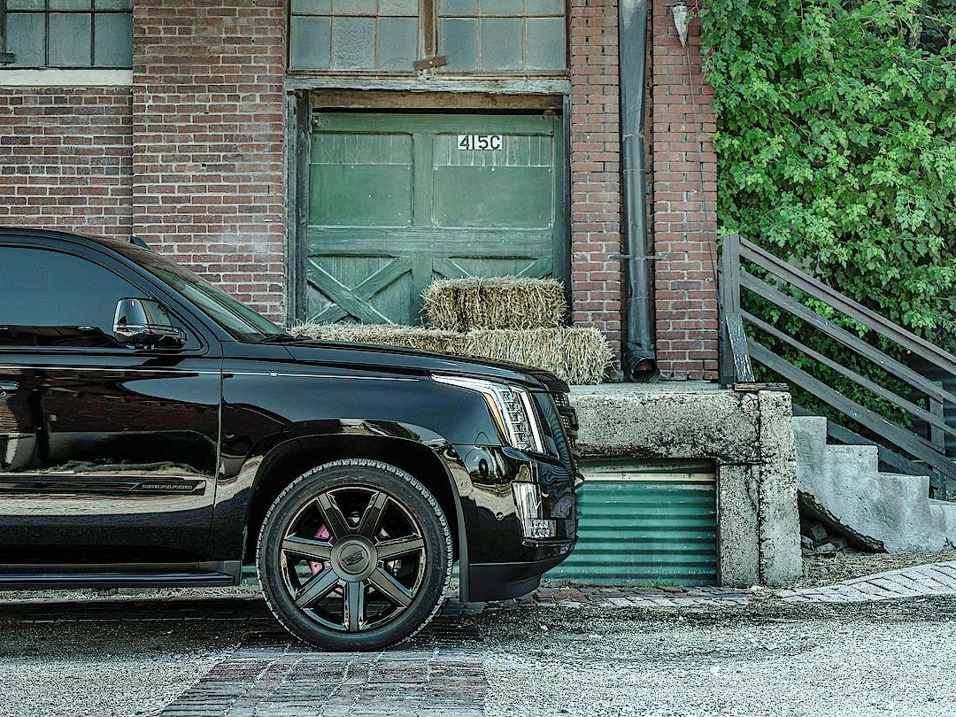Aftermarket Running Boards on Black Cadillac Escalade - Photo by Completed Customs