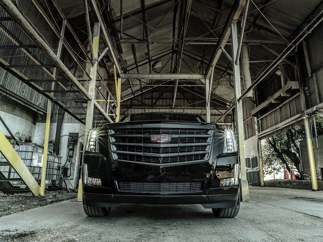 Black Cadillac Escalade with Custom Front Bumper - Photo by Completed Customs