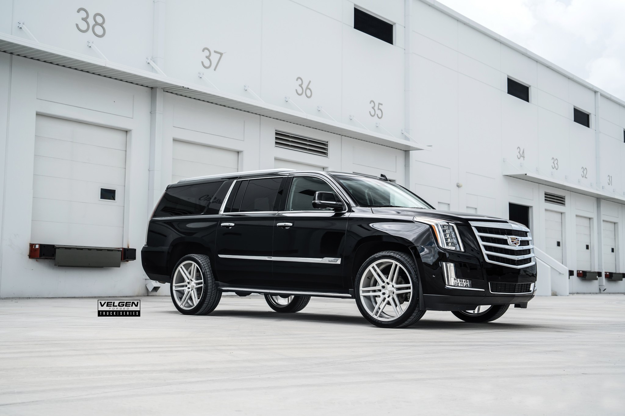 Black Cadillac Escalade with Aftermarket LED Headlights - Photo by Velgen
