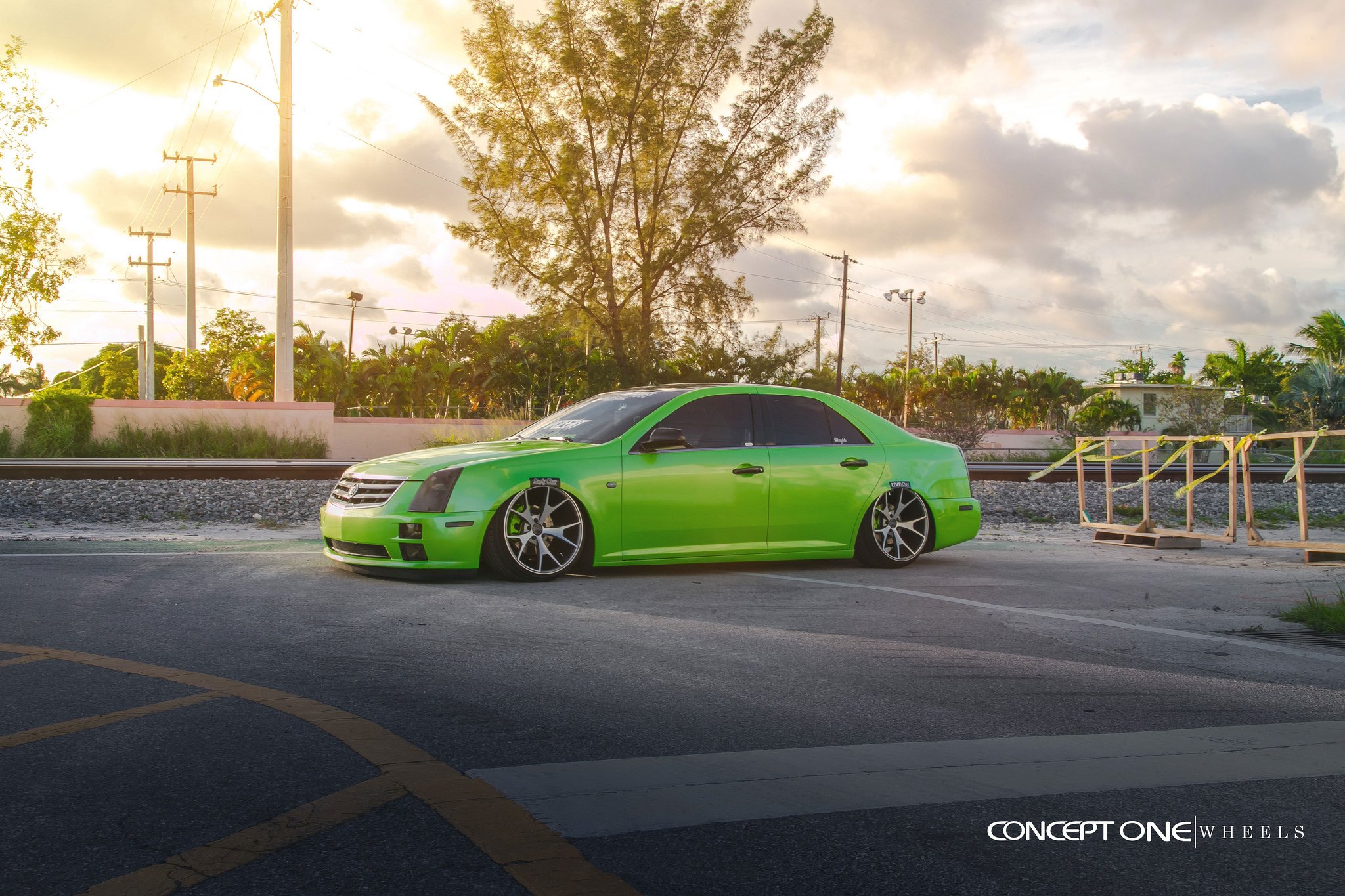 Custom Front Bumper on Green Lowered Cadillac STS - Photo by Concept One