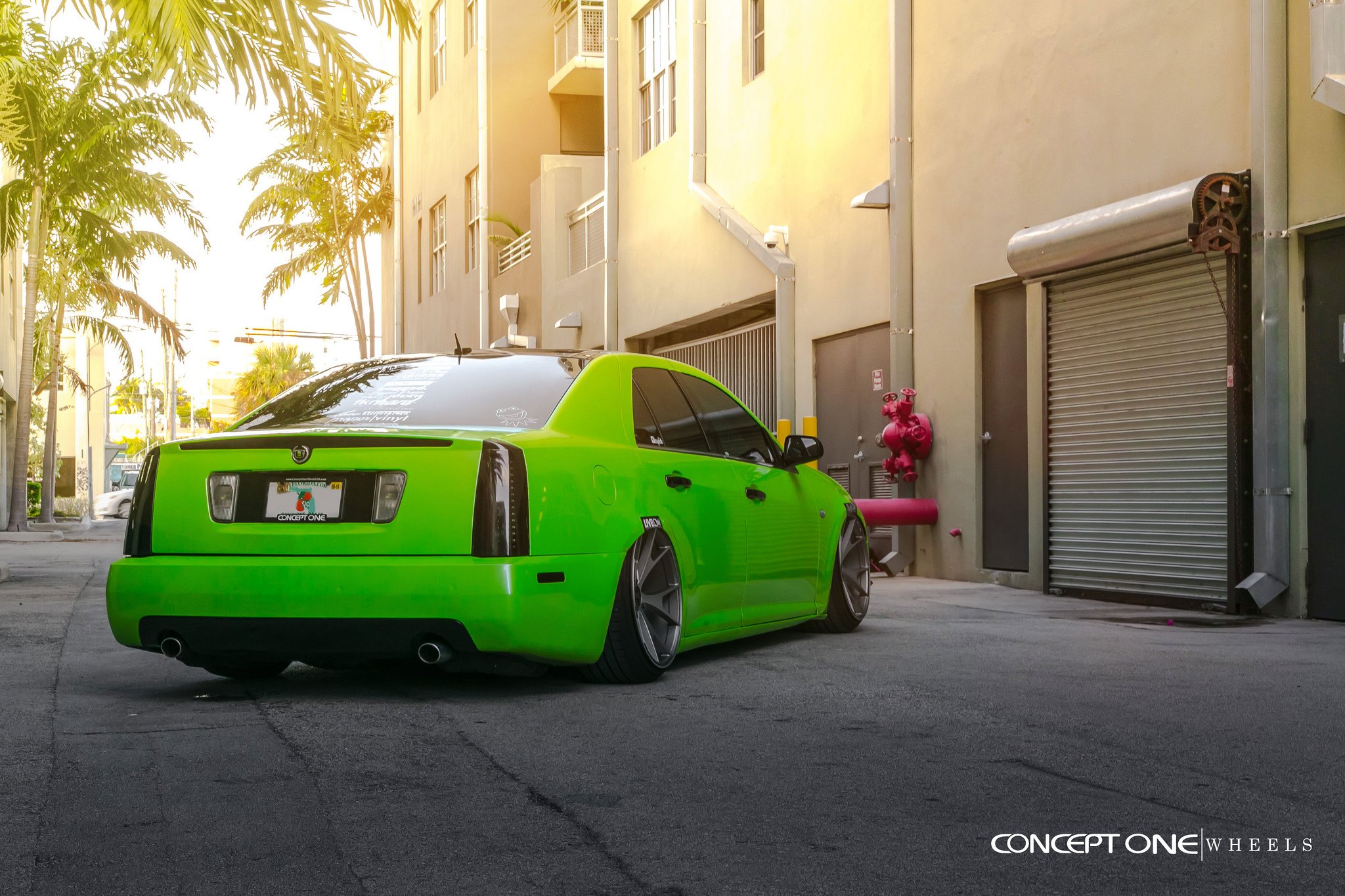 Green Cadillac STS with Dark Smoke Taillights - Photo by Concept One