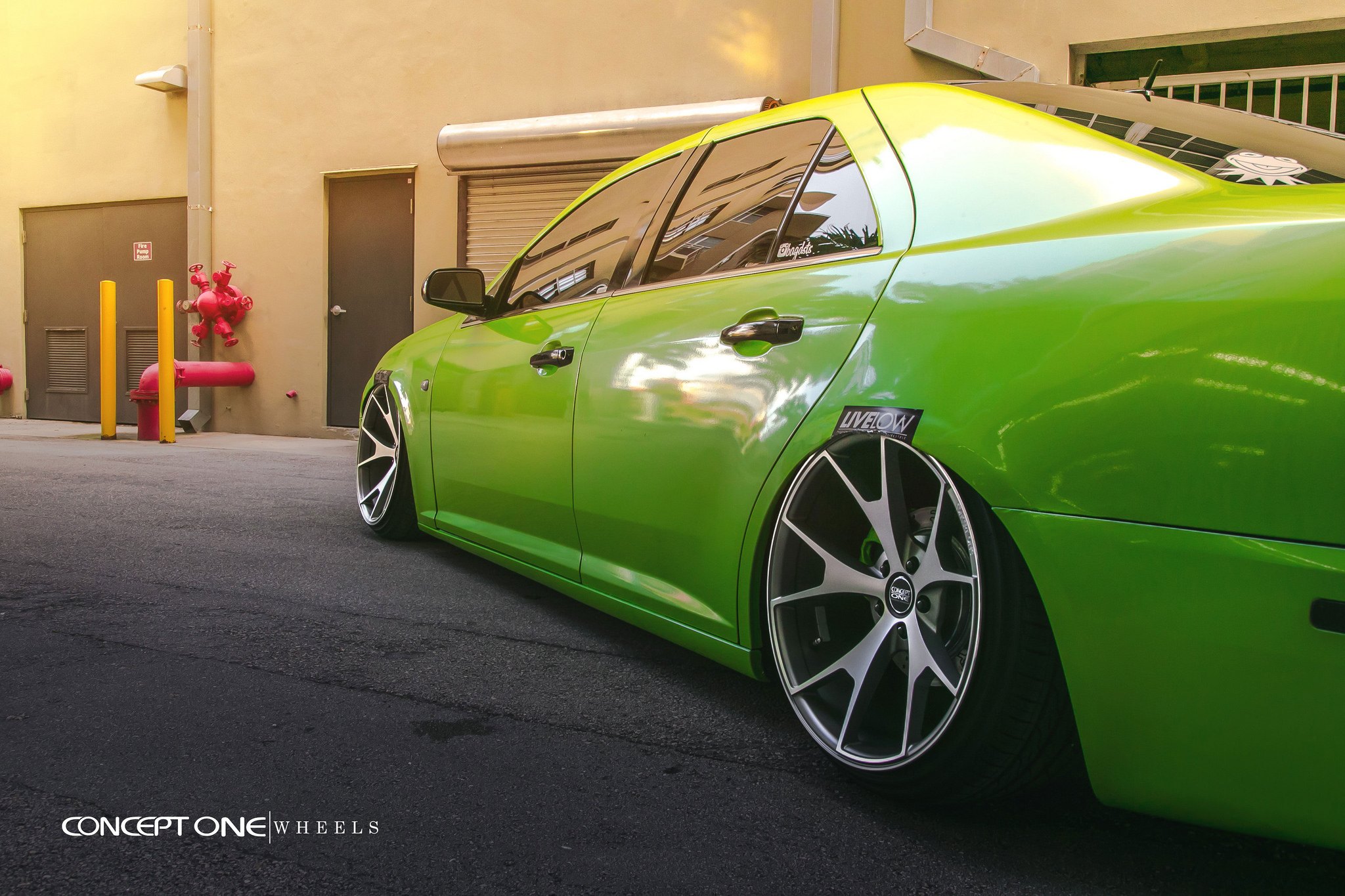 Aftermarket Side Skirts on Green Lowered Cadillac STS - Photo by Concept One