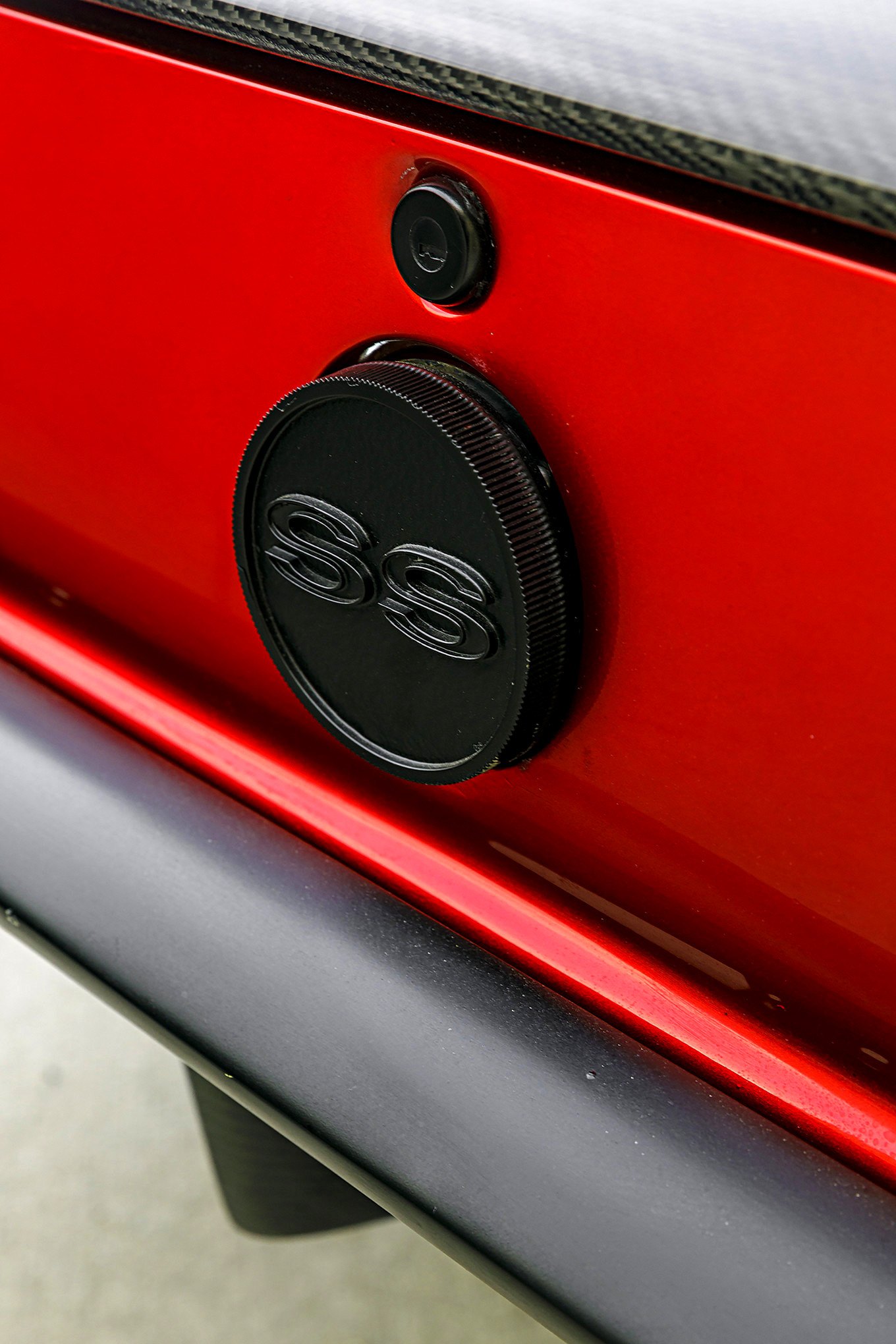 Carbon Fiber Emblem on Red Chevy Camaro SS - Photo by Robert McGaffin