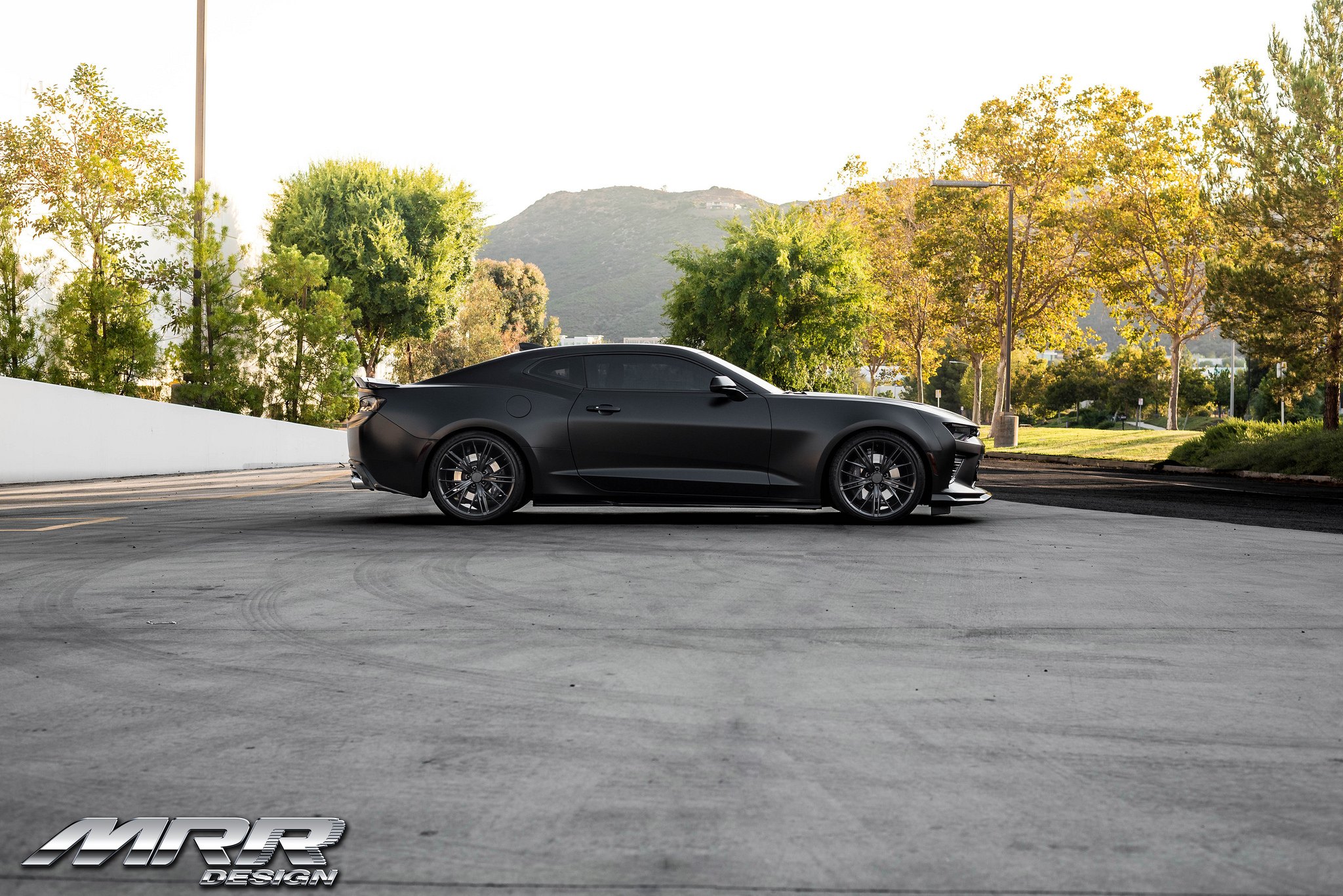 Aftermarket Side Skirts on Black Chevy Camaro - Photo by MRR