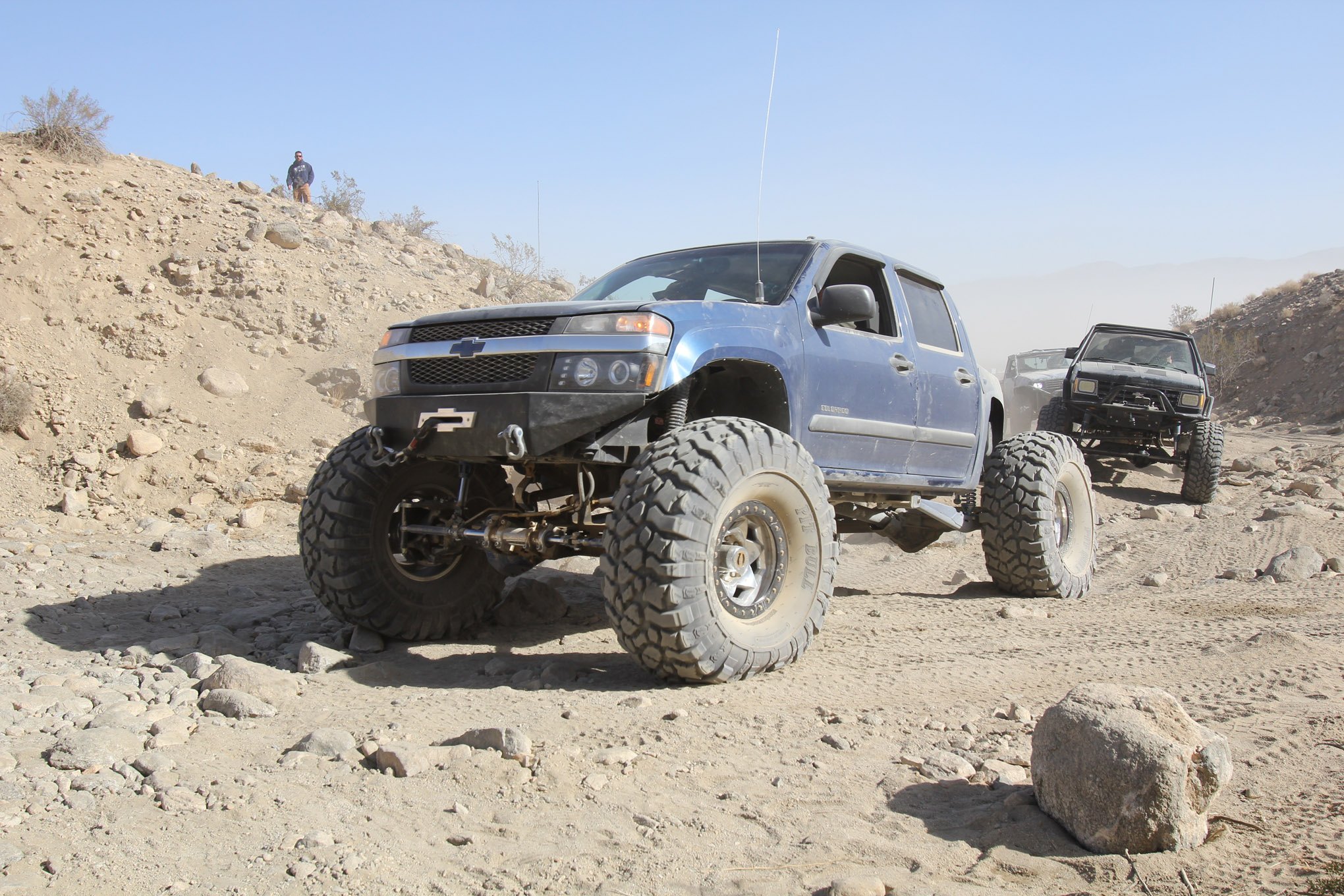 Aftermarket Headlights on Blue Lifted Chevy Colorado - Photo by fourwheeler.com