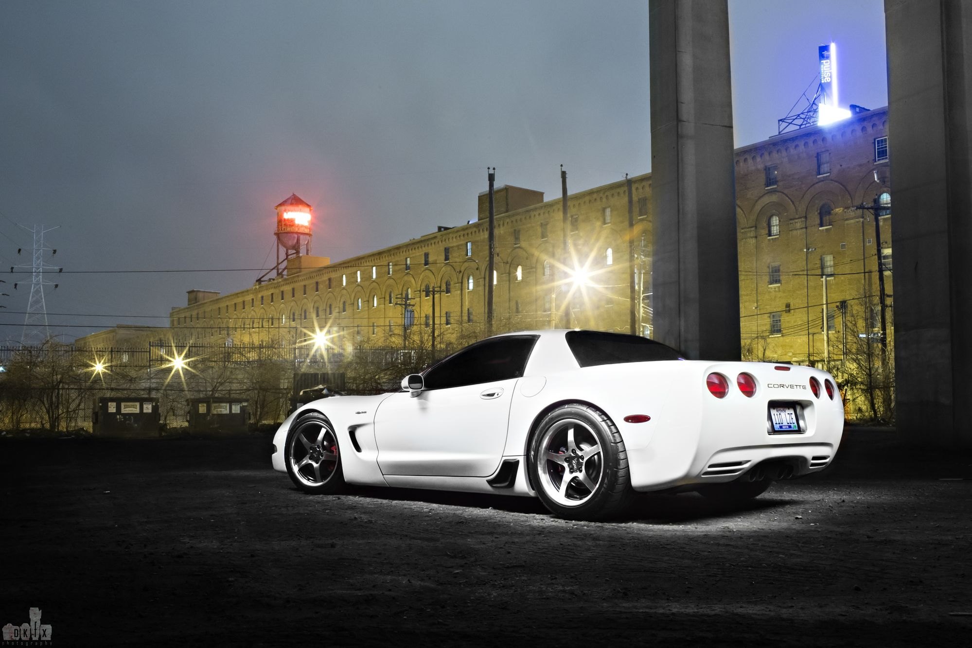 White Chevy Corvette with Custom Chrome Wheels - Photo by dan kinzie