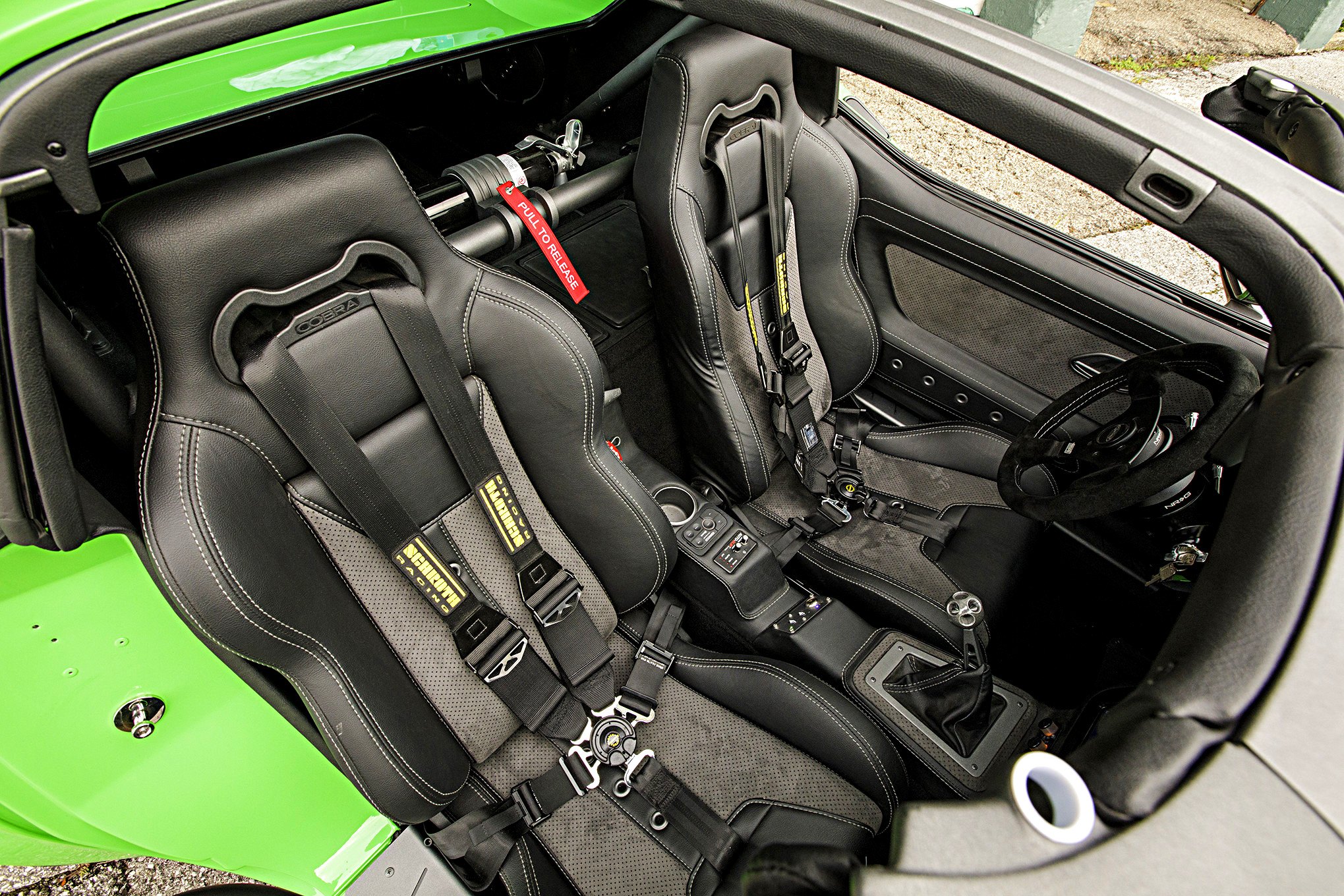 Cobra Racing Seats in Green Debadged Chevy Corvette - Photo by Robert McGaffin