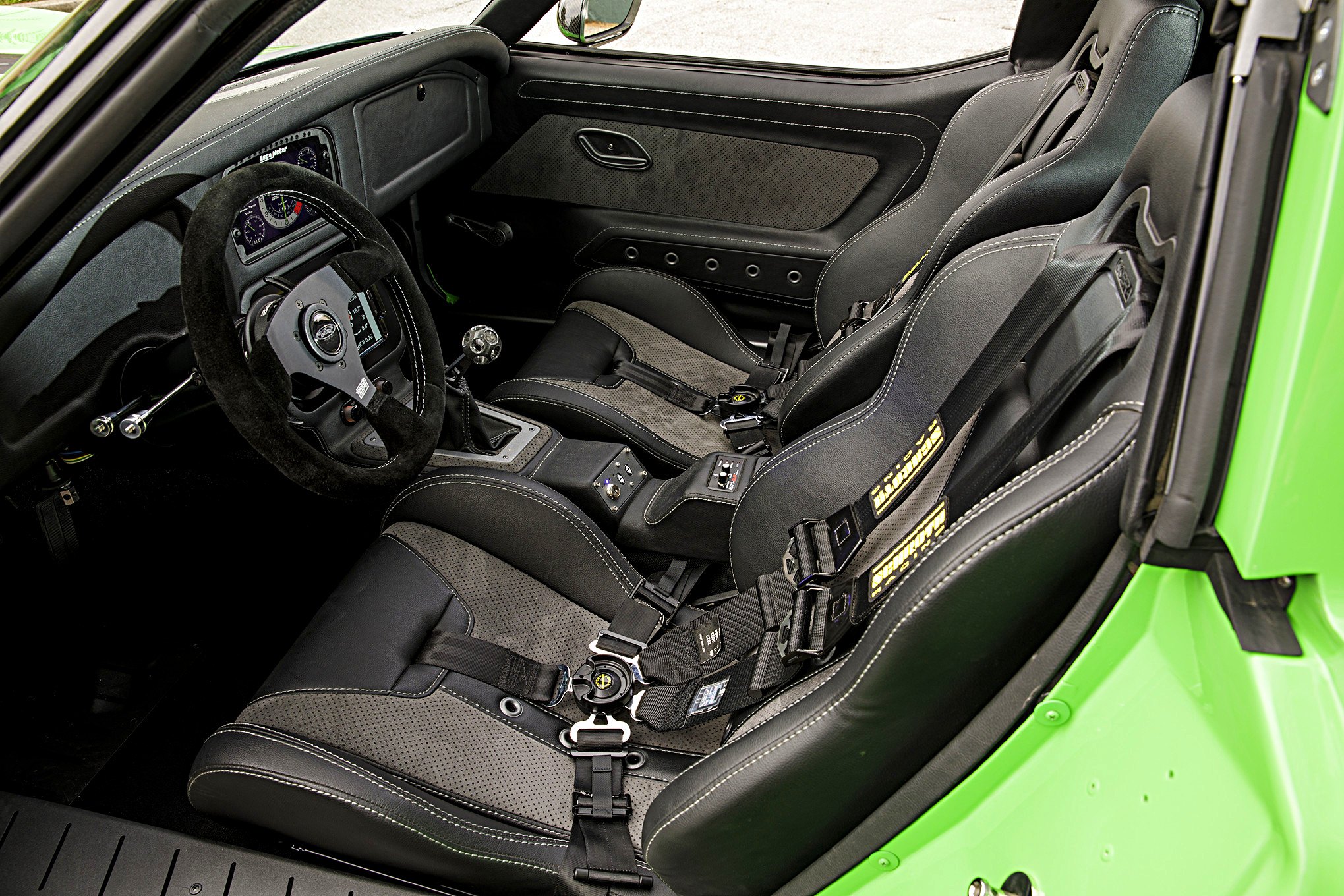 Green Debadged Chevy Corvette with Aftermarket Steering Wheel - Photo by Robert McGaffin
