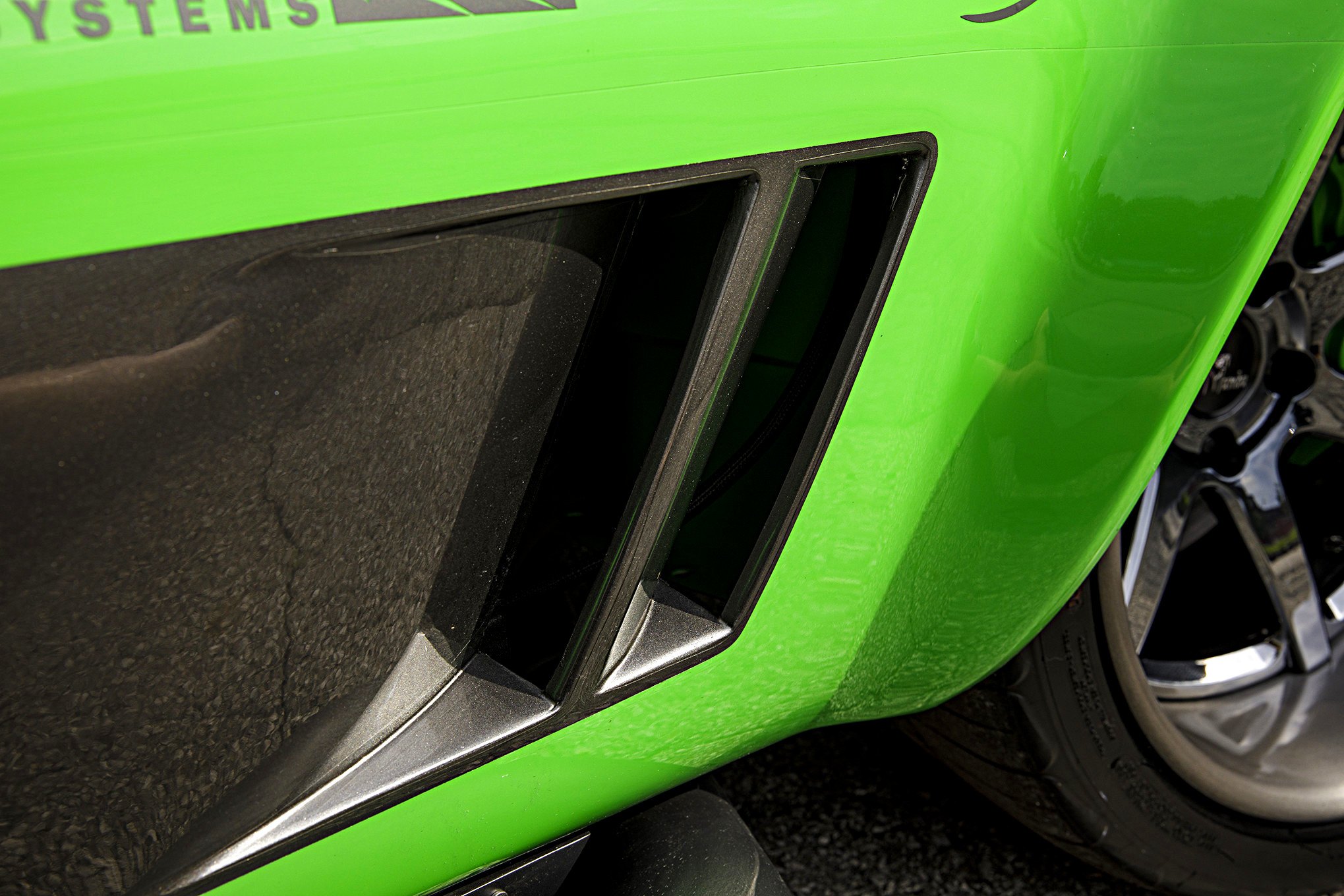 Aftermarket Side Vents on Green Debadged Chevy Corvette - Photo by Robert McGaffin
