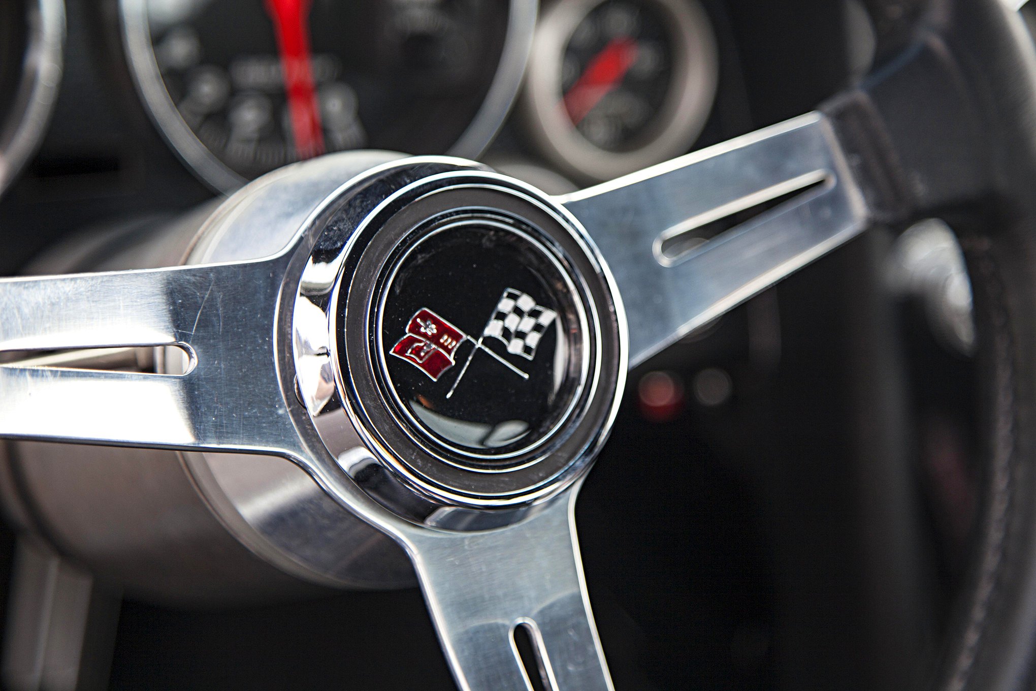 Gray Chevy Corvette with Custom Chrome Steering Wheel - Photo by Jason Lubken