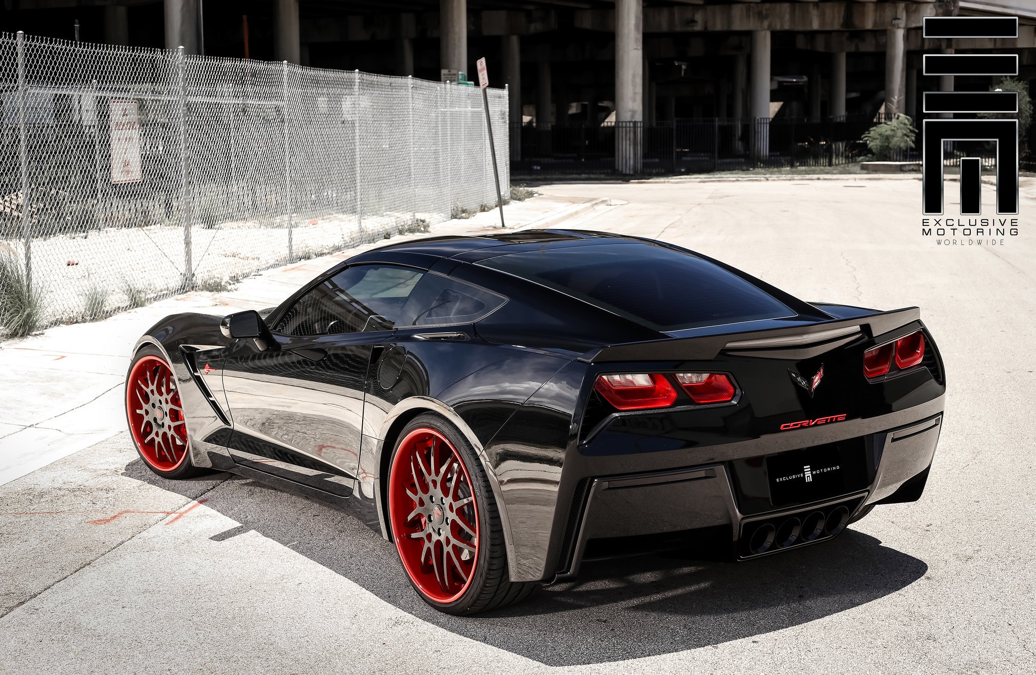 Black on black Corvette C7 rear view - Photo by Exclusive Motoring