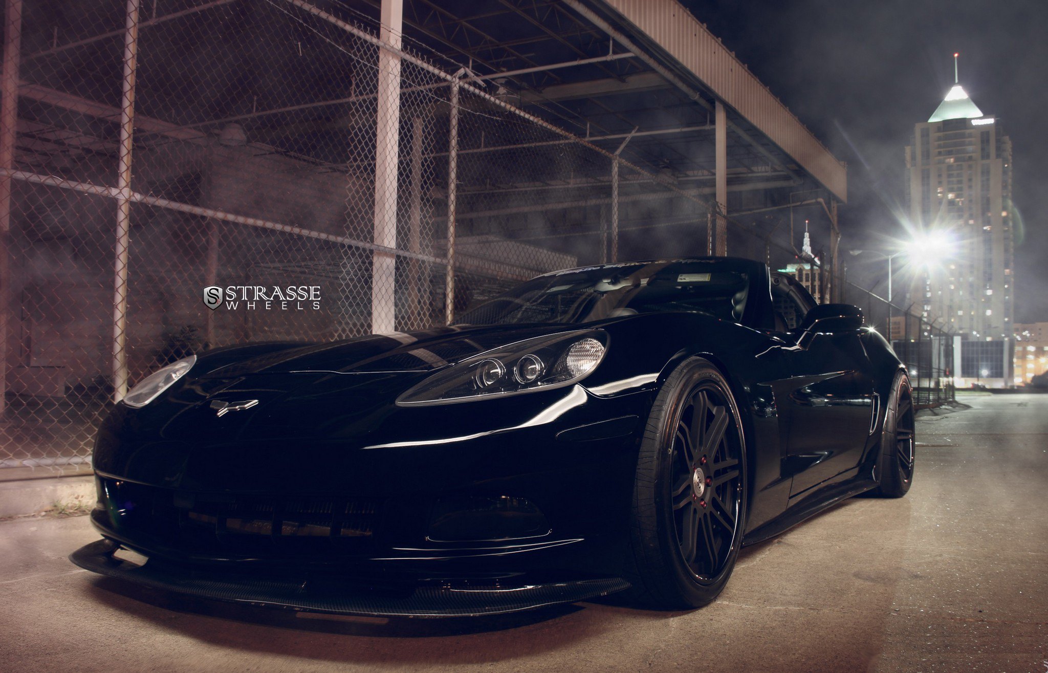 Carbon Fiber Front Lip on Black Chevy Corvette - Photo by Custom Black Chevy Corvette Gets Even More Aggressive with Dark Smoke Headlights				Strasse Forged