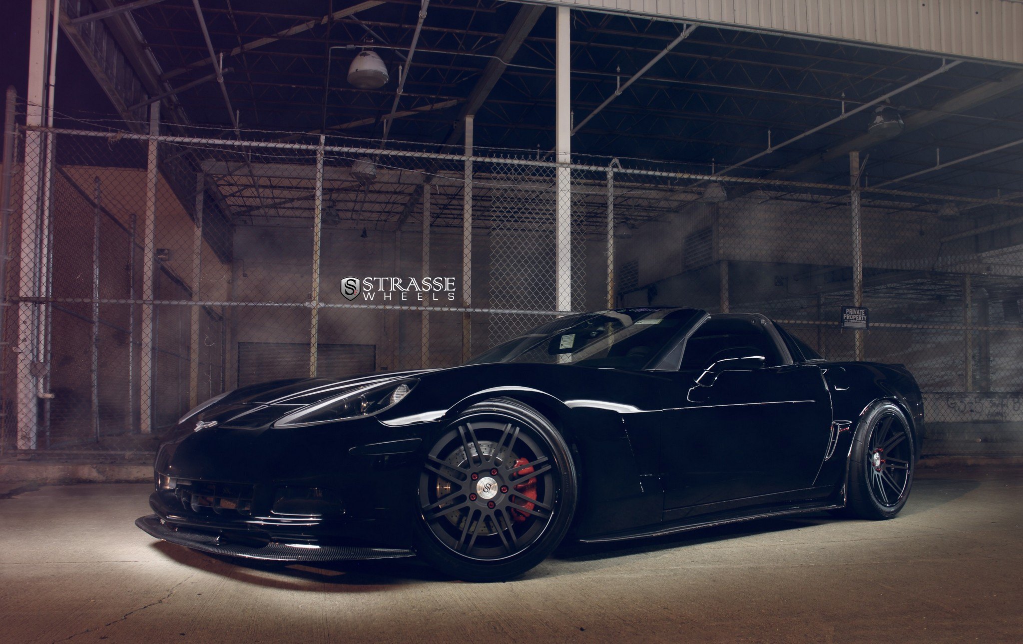 Black Chevy Corvette with Carbon Fiber Side Skirts - Photo by Custom Black Chevy Corvette Gets Even More Aggressive with Dark Smoke Headlights				Strasse Forged