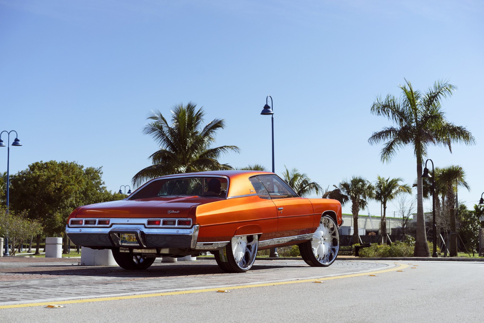 30 Inch XB7 DUB Wheels on Orange Chevy Impala - Photo by DUB