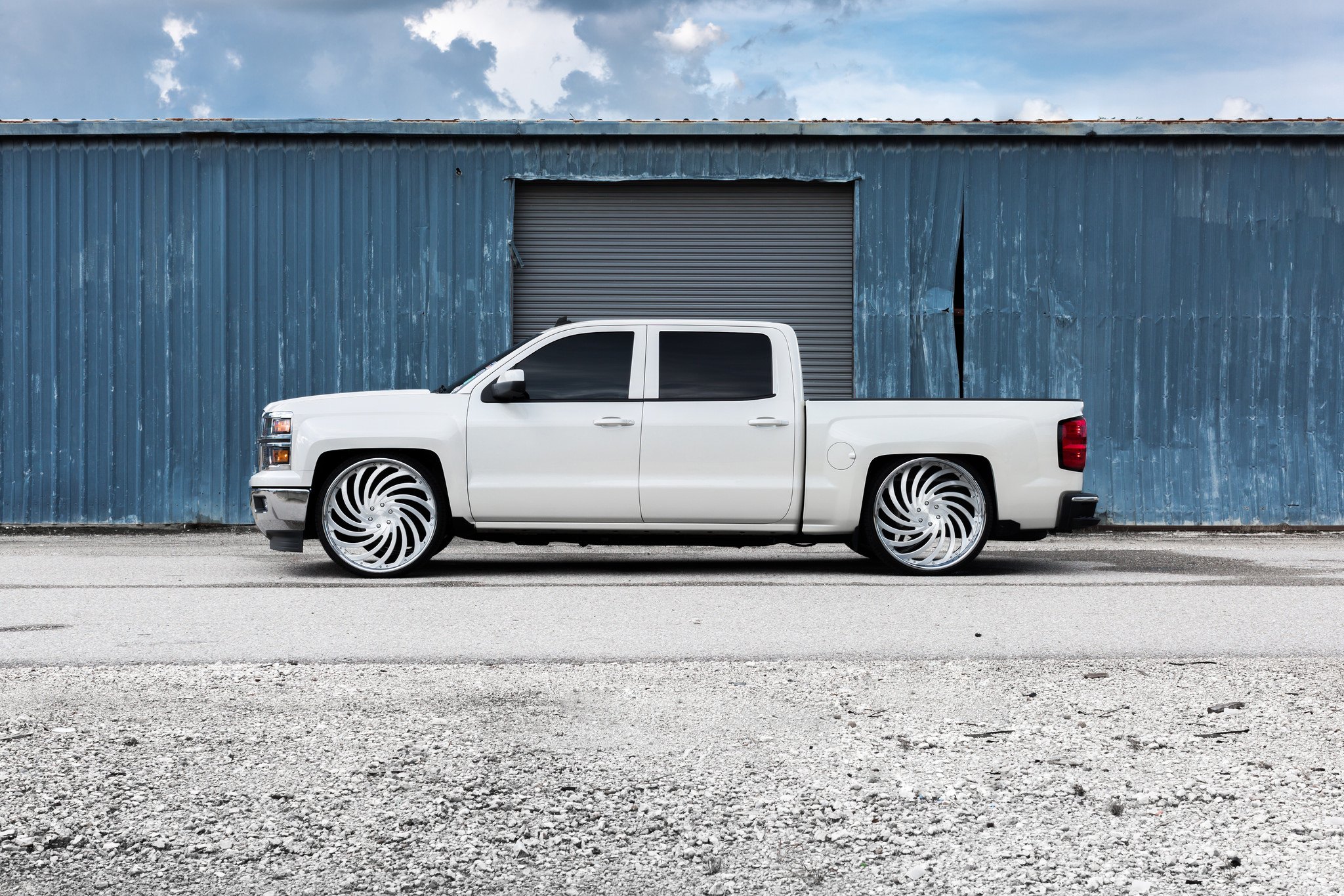 White Chevy Silverado with Aftermarket Side Steps - Photo by Dub Wheels