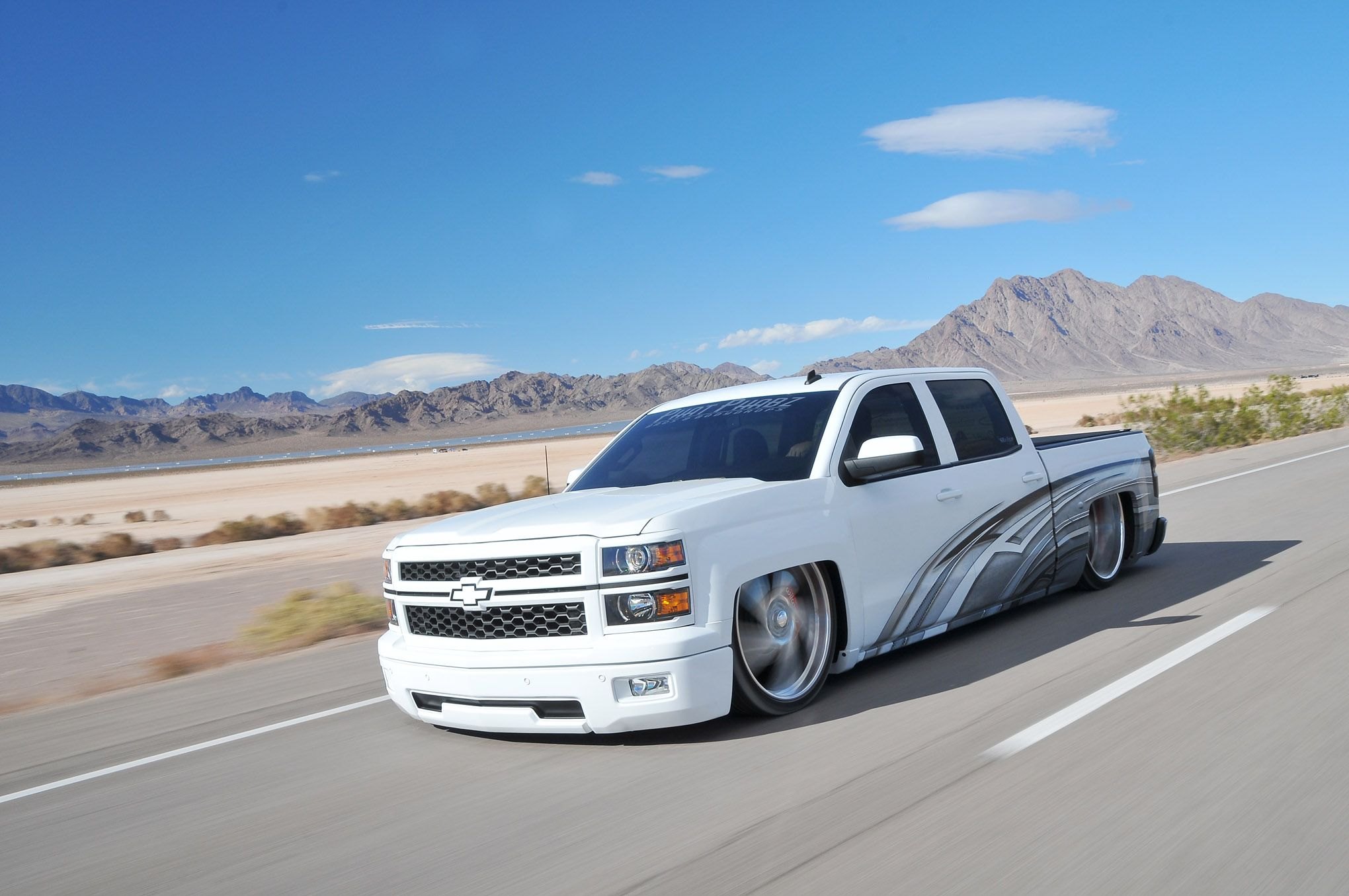 Aftermarket Headlights on White Lowered Chevy Silverado - Photo by Phil Gordon