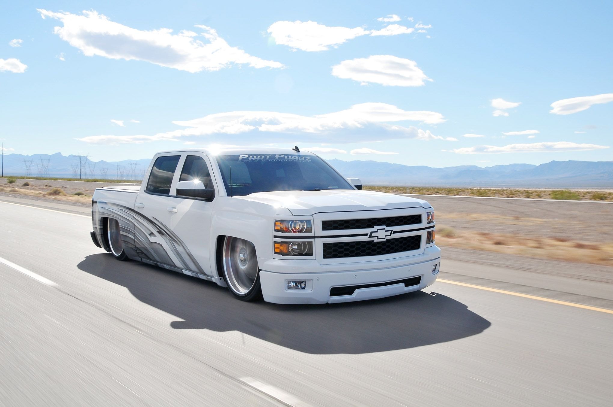White Lowered Chevy Silverado with Custom Mesh Grille - Photo by Phil Gordon