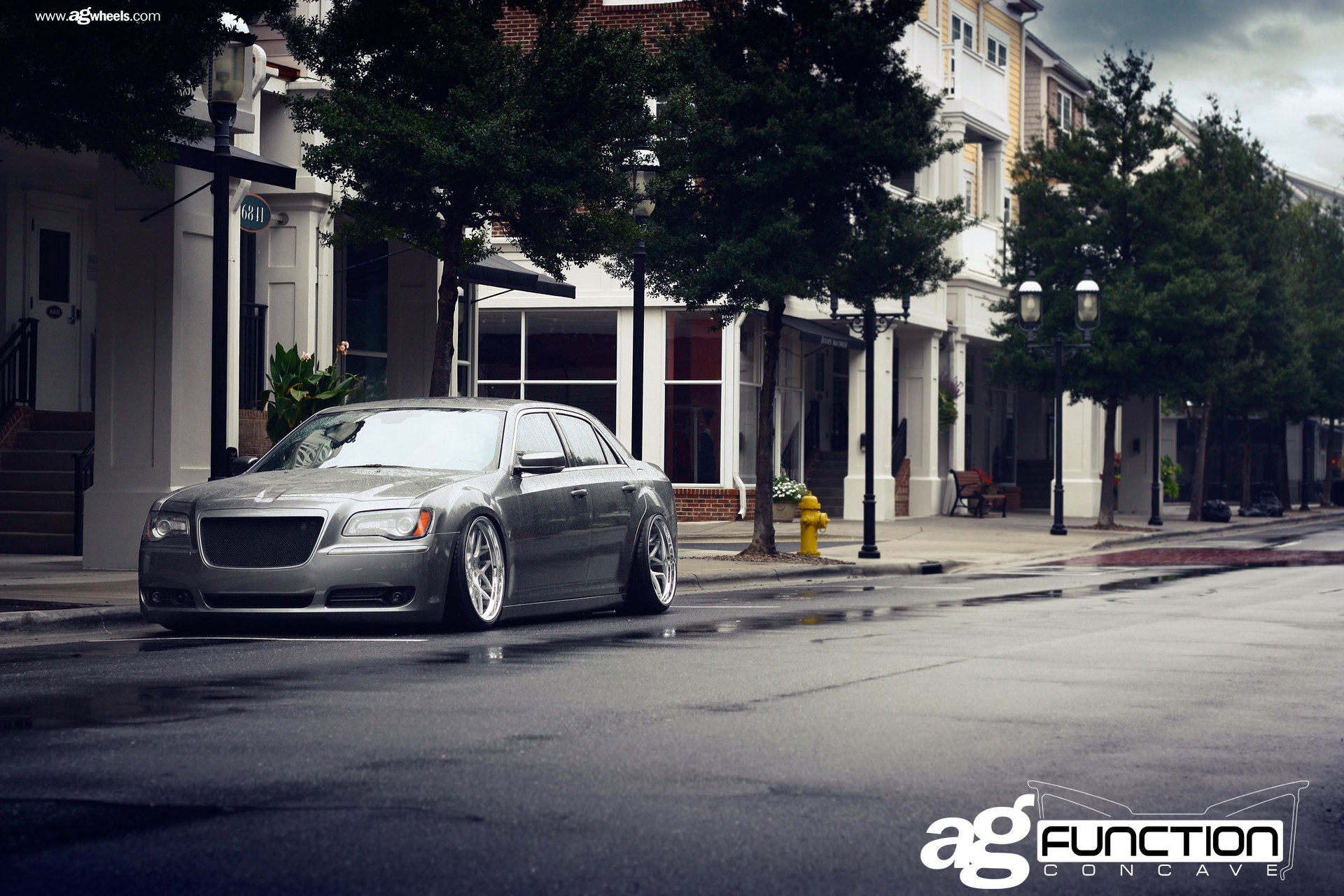 Gray Stanced Chrysler 300 with Aftermarket Headlights - Photo by Avant Garde Wheels