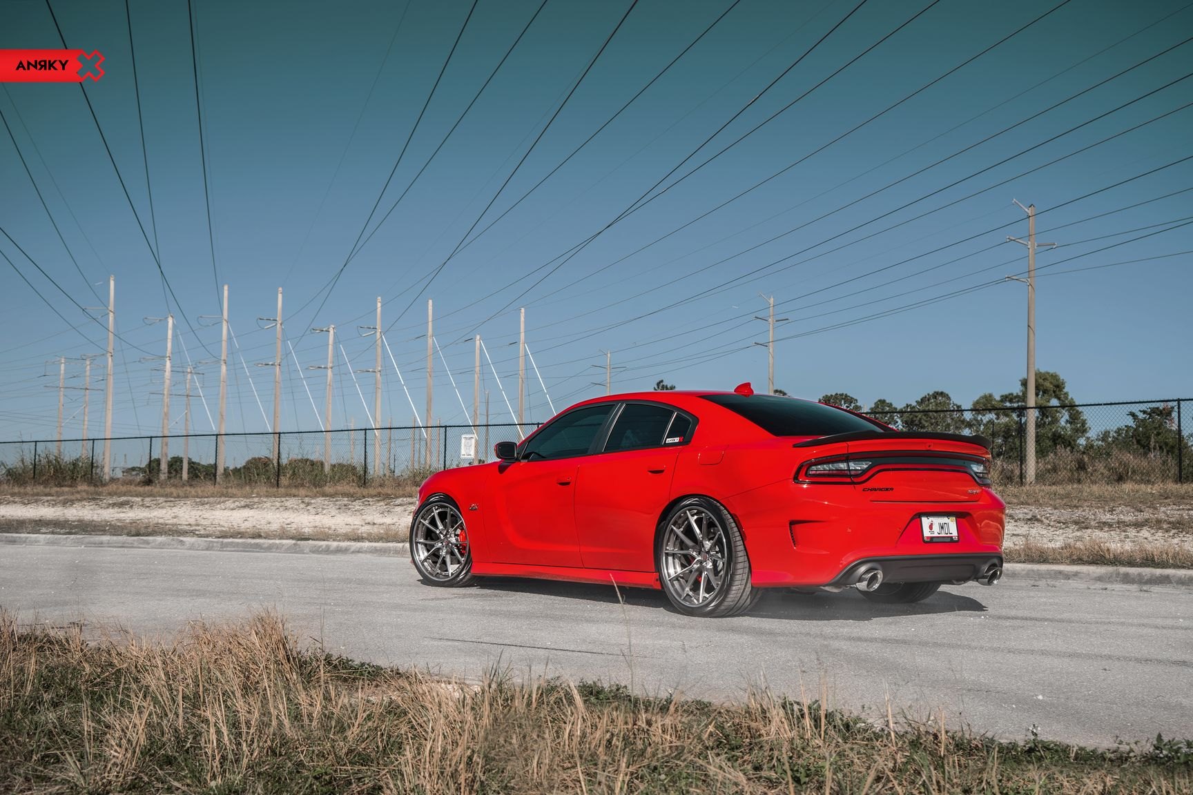 Red Dodge Charger with Aftermarket Rear Spoiler - Photo by Anrky Wheels