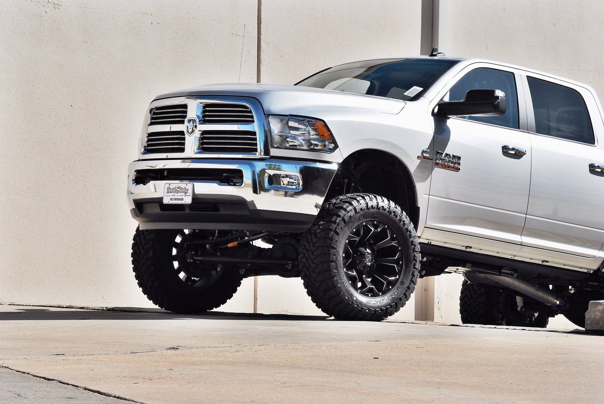 Aftermarket Front Bumper on White Lifted Dodge Ram - Photo by Fuel Offroad