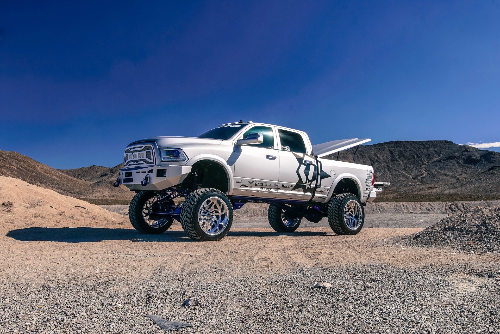 Silver Lifted Dodge Ram with Chrome Mesh Grille - Photo by TIS Wheels
