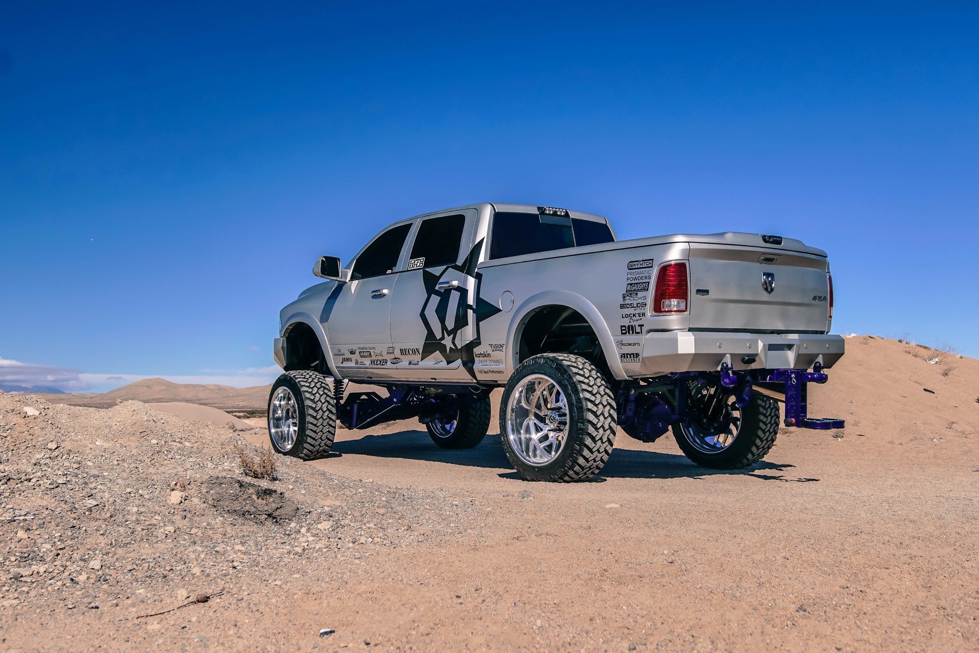 Silver Lifted Dodge Ram with Recon LED Taillights - Photo by TIS Wheels