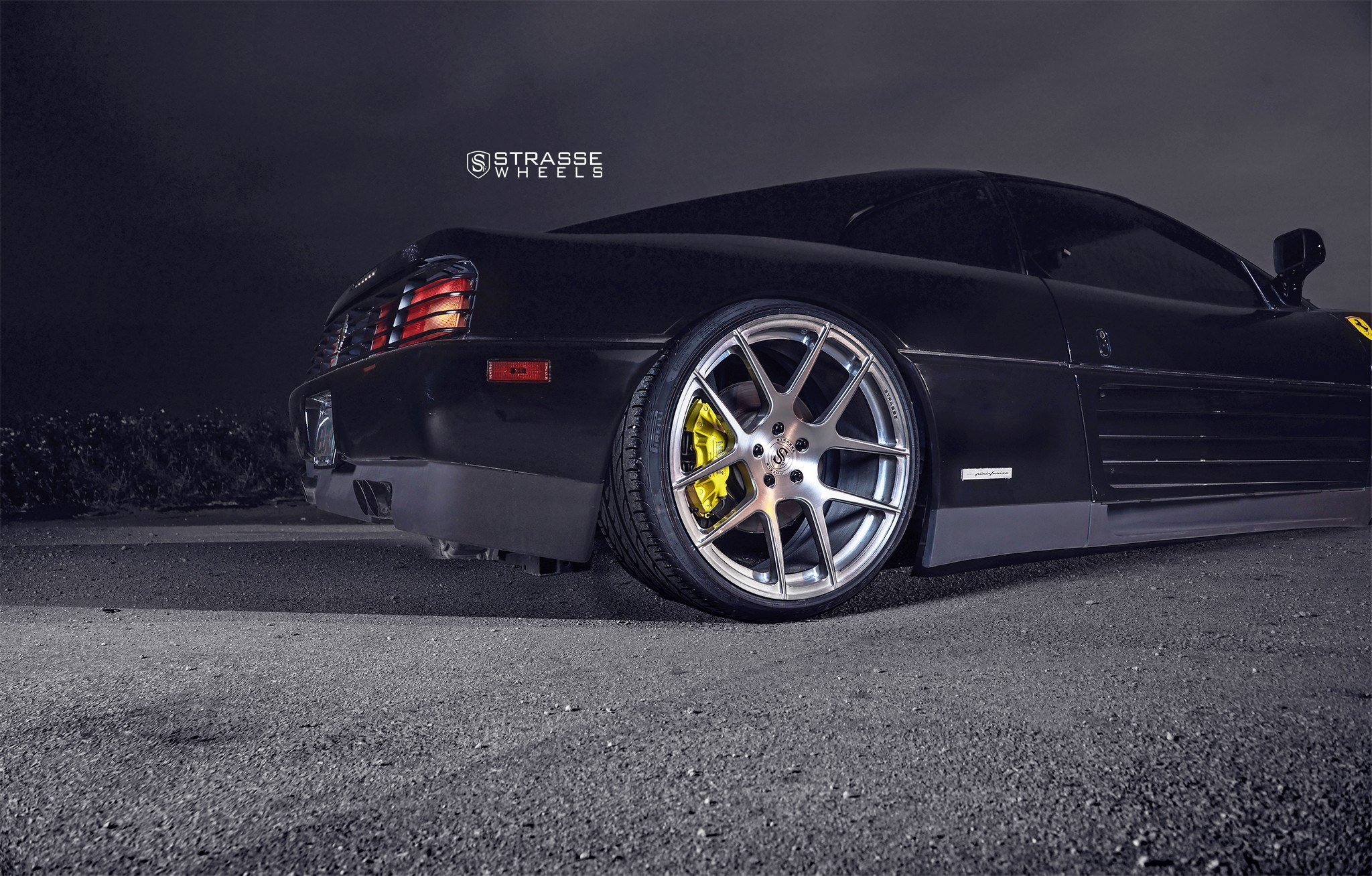 Brushed Titanium Strasse Rims on Black Ferrari 348 - Photo by Strasse Forged