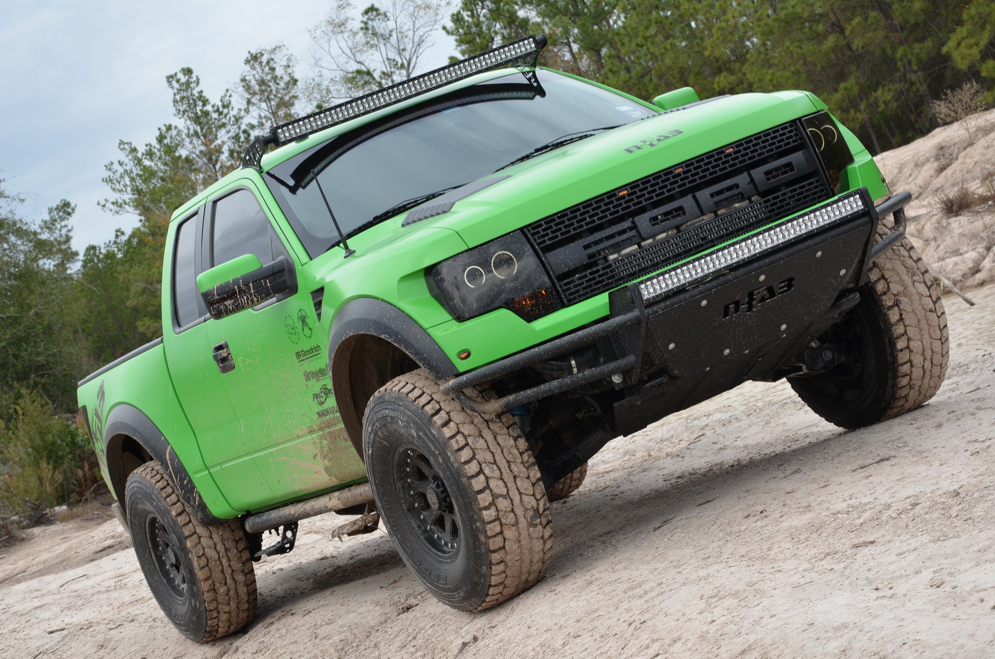 Green Raptor With N-Fab Off-road Bumpers and Side Steps - Photo by Black Rhino
