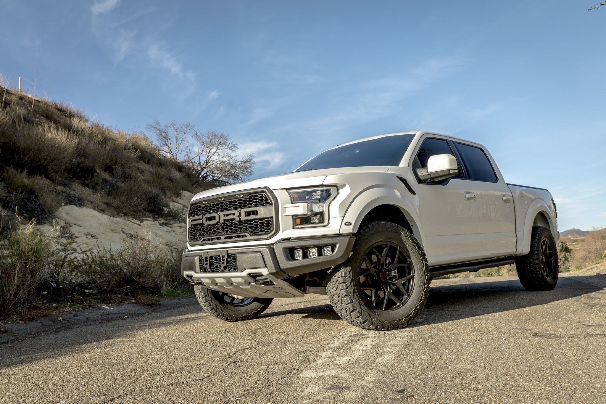 White Lifted Ford F-150 with Aftermarket Headlights  - Photo by Vorsteiner