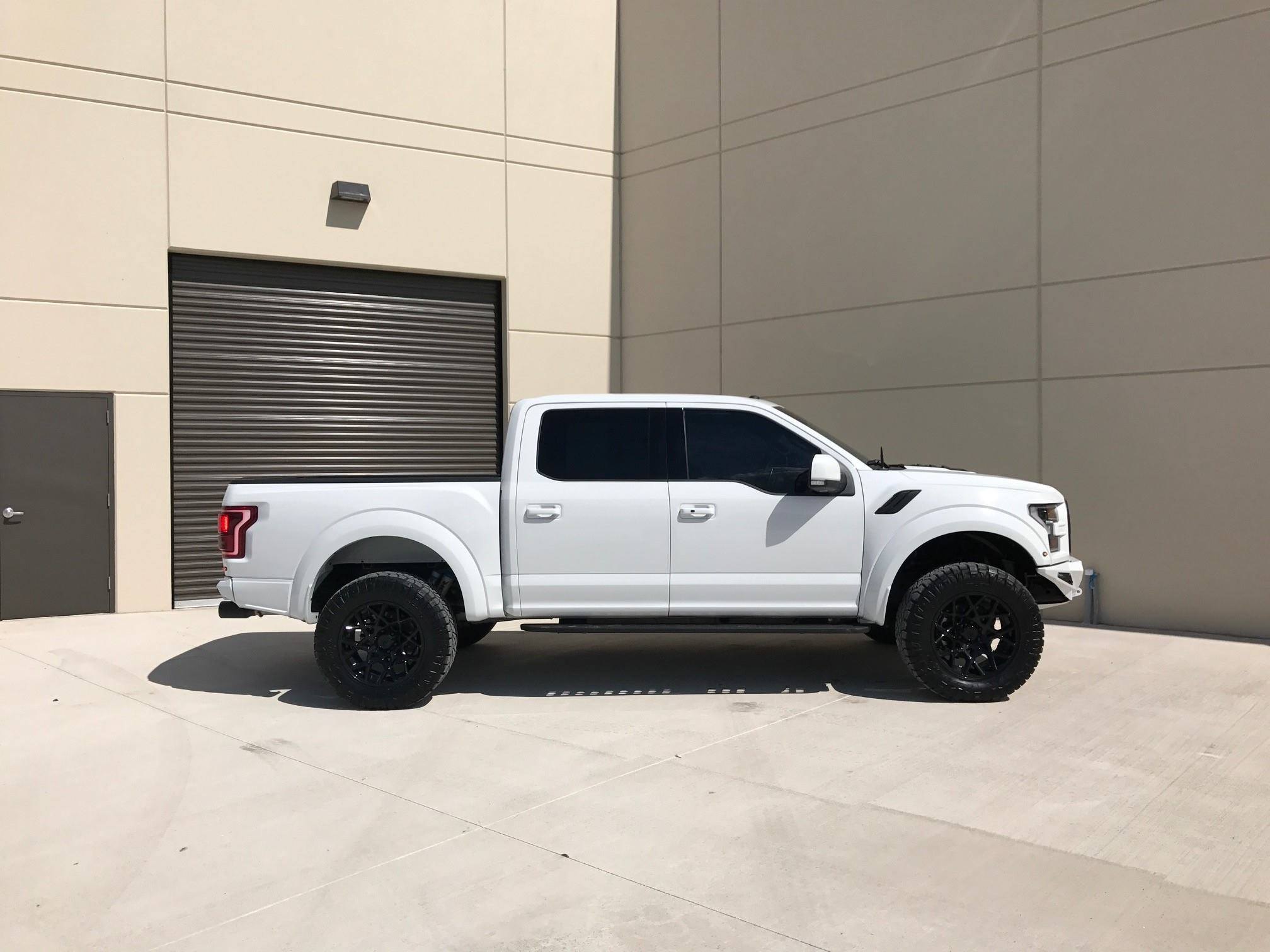 Aftermarket Running Boards on White Lifted Ford F-150 - Photo by Addictive Desert Designs