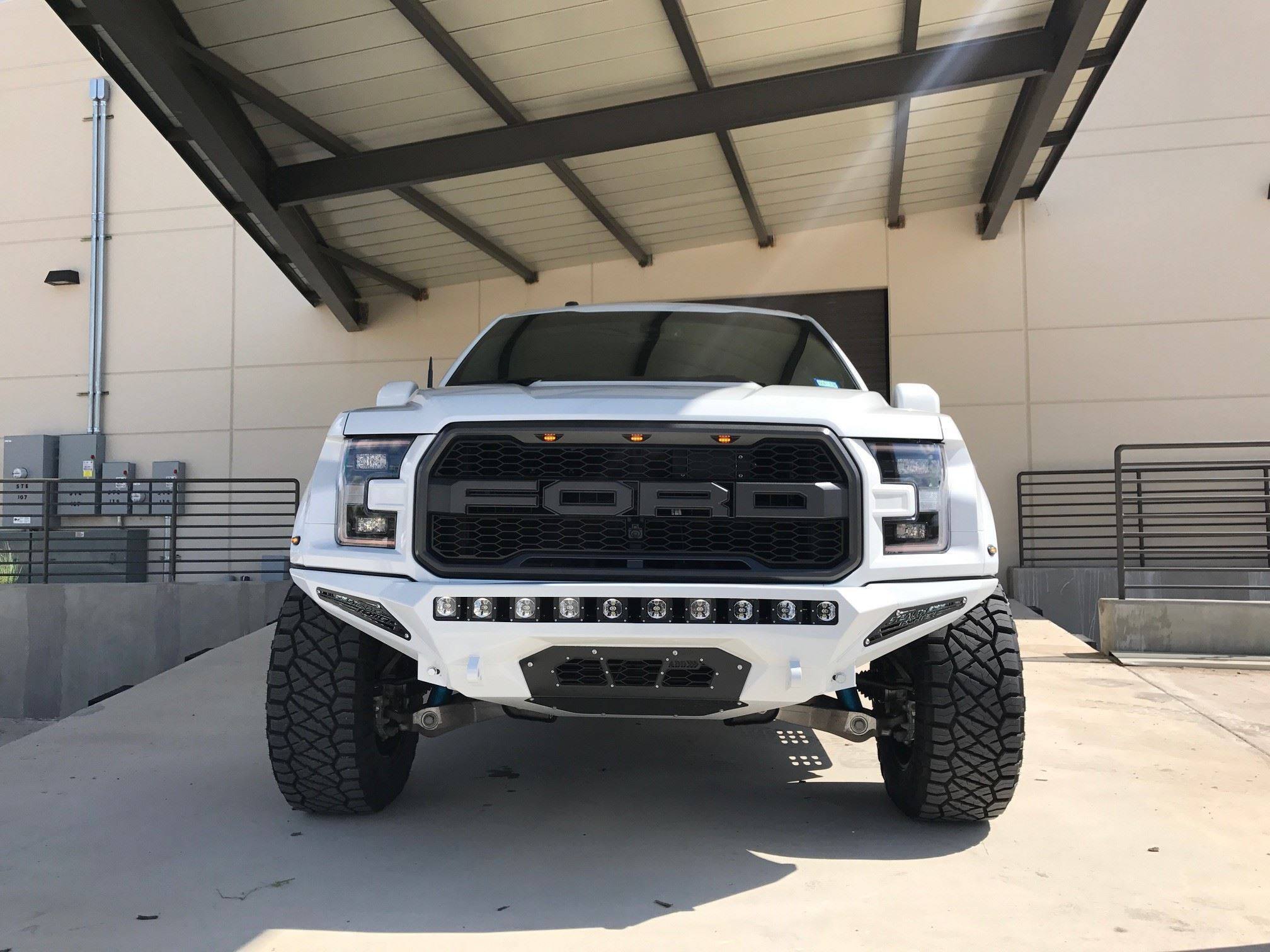 White Lifted Ford F-150 with Blacked Out Mesh Grille - Photo by Addictive Desert Designs