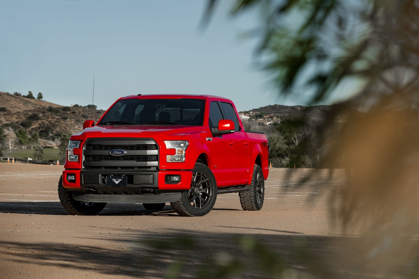 Red Ford F-150 with Aftermarket Projector Headlights - Photo by Venom Rex