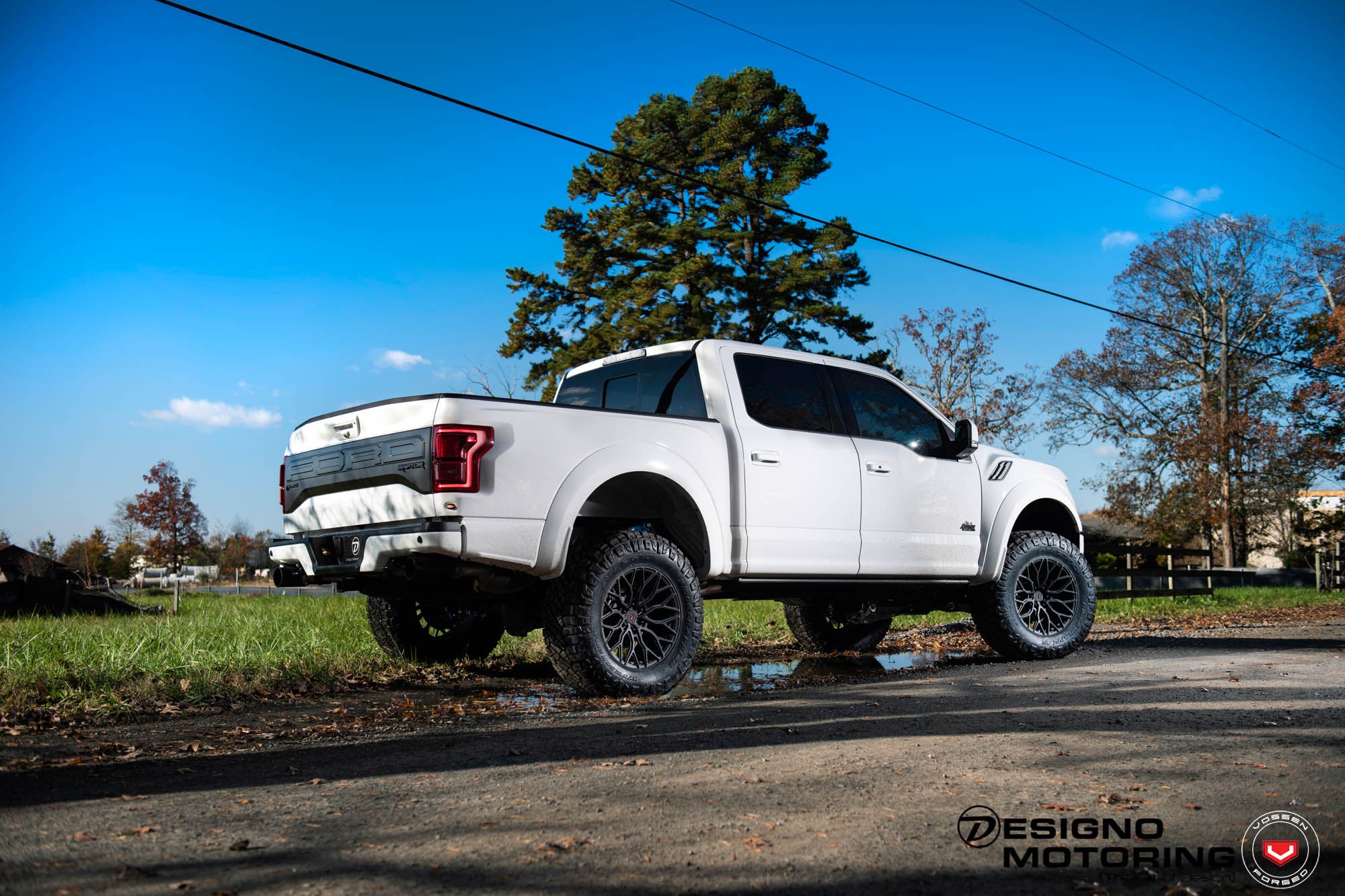 White Lifted Ford F-150 with Custom Red Taillights - Photo by Vossen Wheels