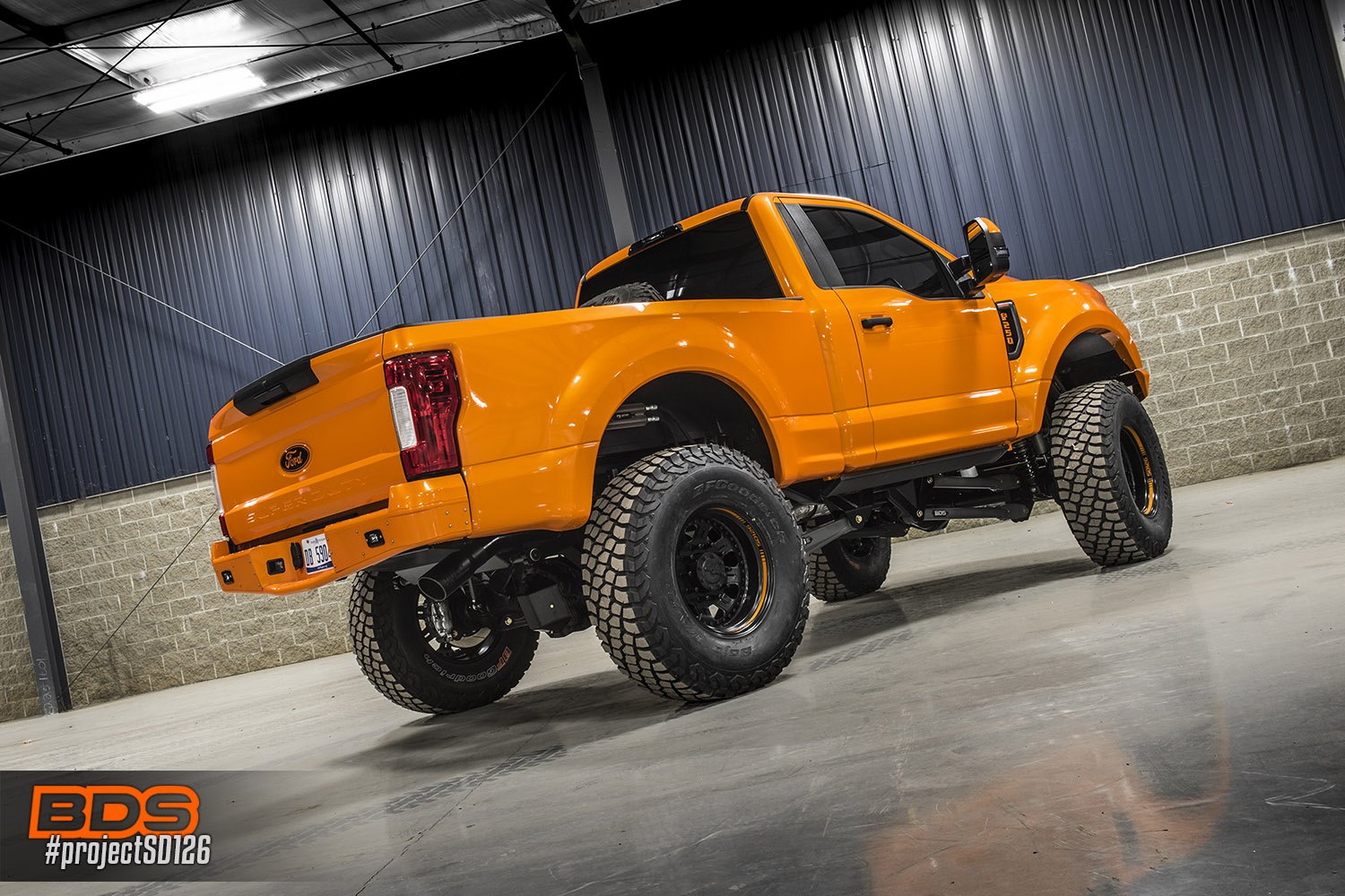 Red LED Taillights on Orange Lifted Ford F-250 - Photo by BDS Suspension