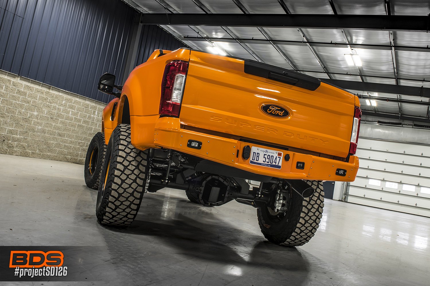 Orange Lifted Ford F-250 with Off-Road Rear Bumper - Photo by BDS Suspension