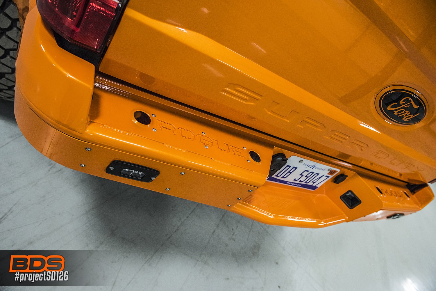 Off-Road Rear Bumper with LED Lights on Orange Ford F-250 - Photo by BDS Suspension