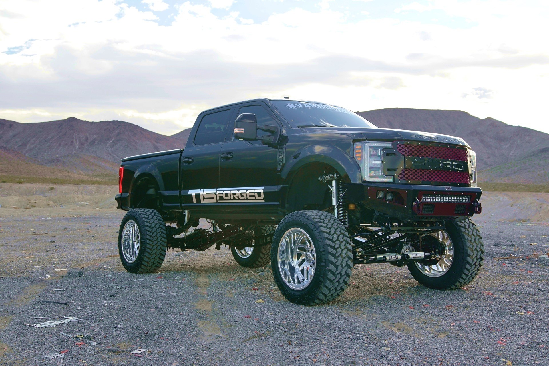 Black Lifted Ford F-250 with Custom Grille - Photo by TIS Wheels