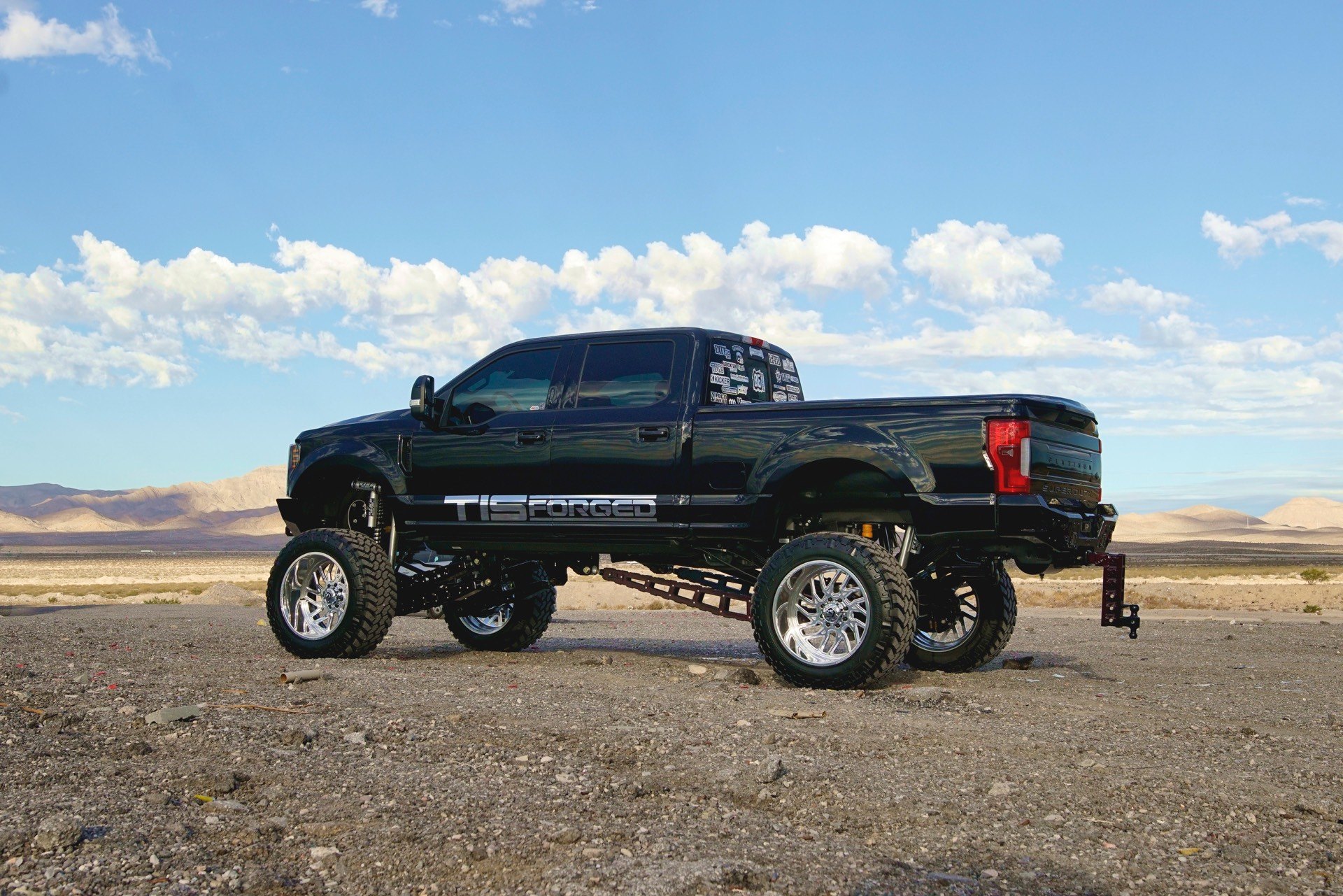 Black Lifted Ford F-250 with Red LED Taillights - Photo by TIS Wheels