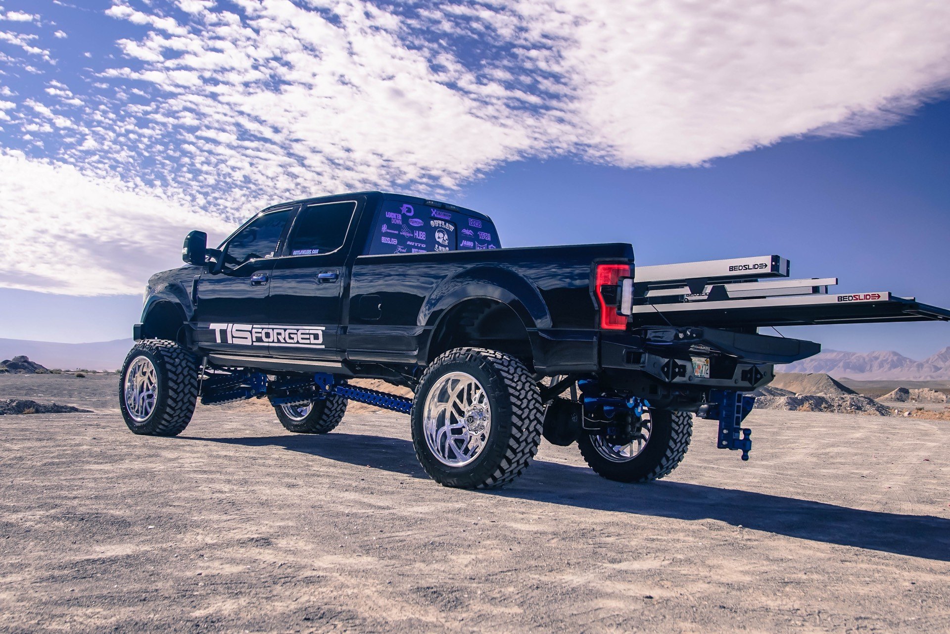 Black Lifted Ford F-250 with Bedslide Bed Slides - Photo by TIS Wheels