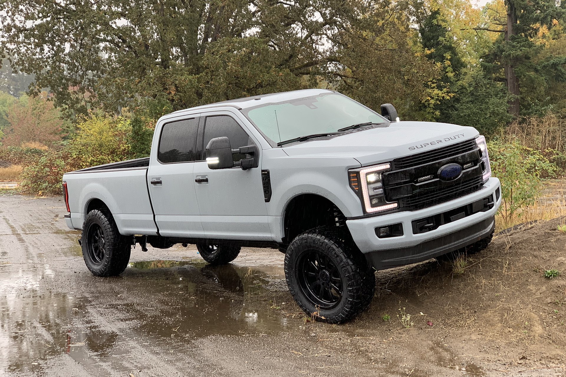 Gray Lifted Ford F-250 with Aftermarket LED Headlights - Photo by Forgiato