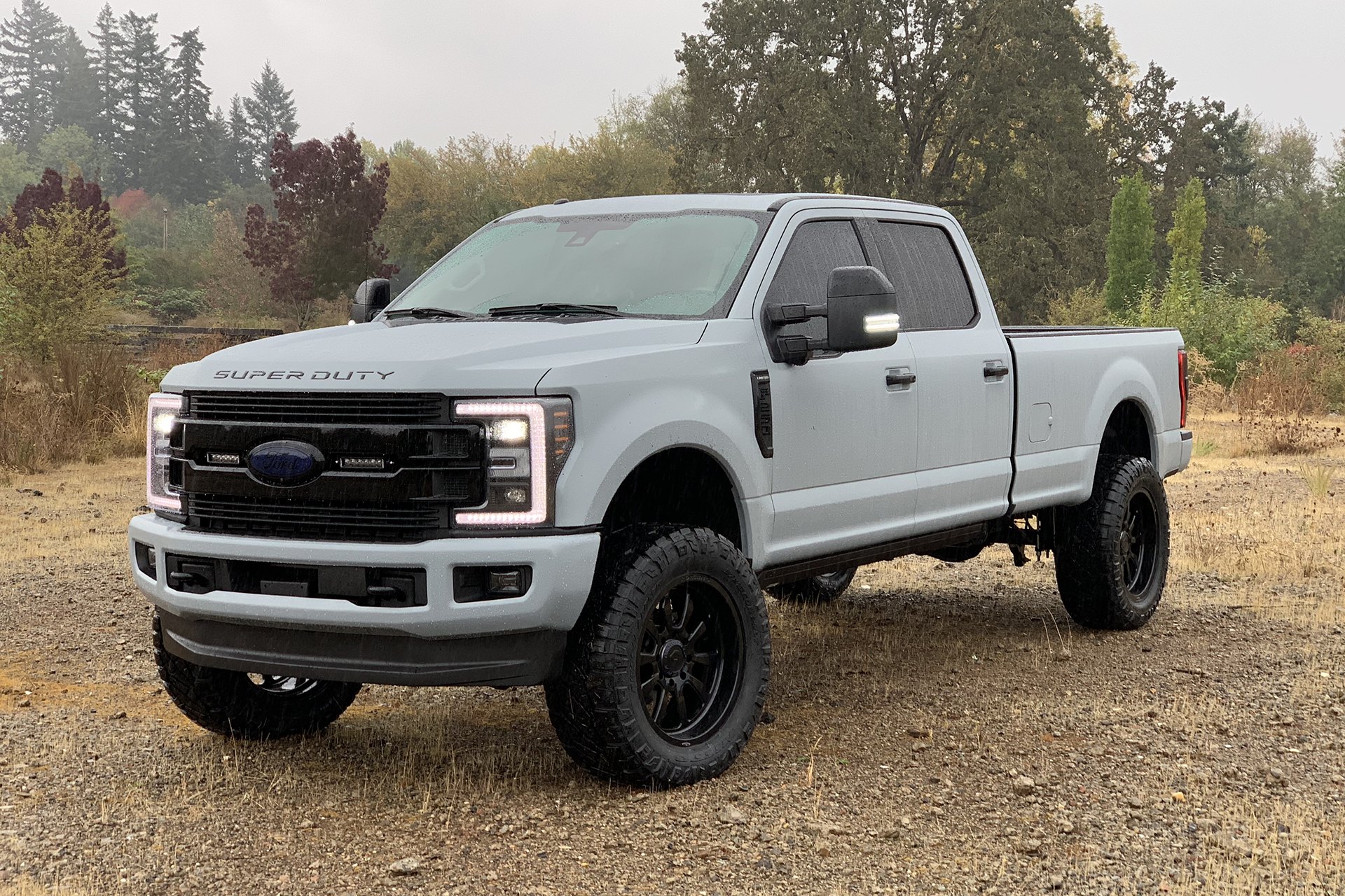 Gray Lifted Ford F-250 with Aftermarket Side Mirrors - Photo by Forgiato