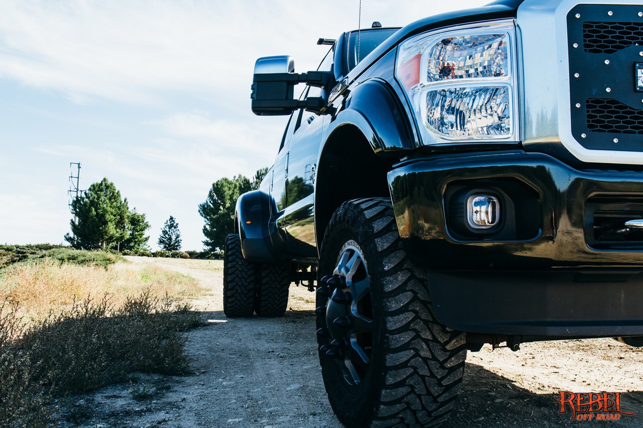 Black Lifted Ford F-350 with Custom Headlights - Photo by Rebel Off-Road