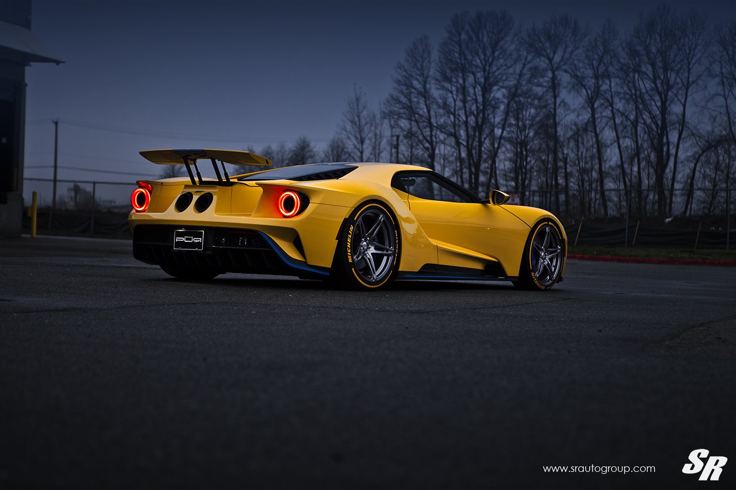 Aftermarket Side Skirts on Yellow Ford GT - Photo by SR Auto Group