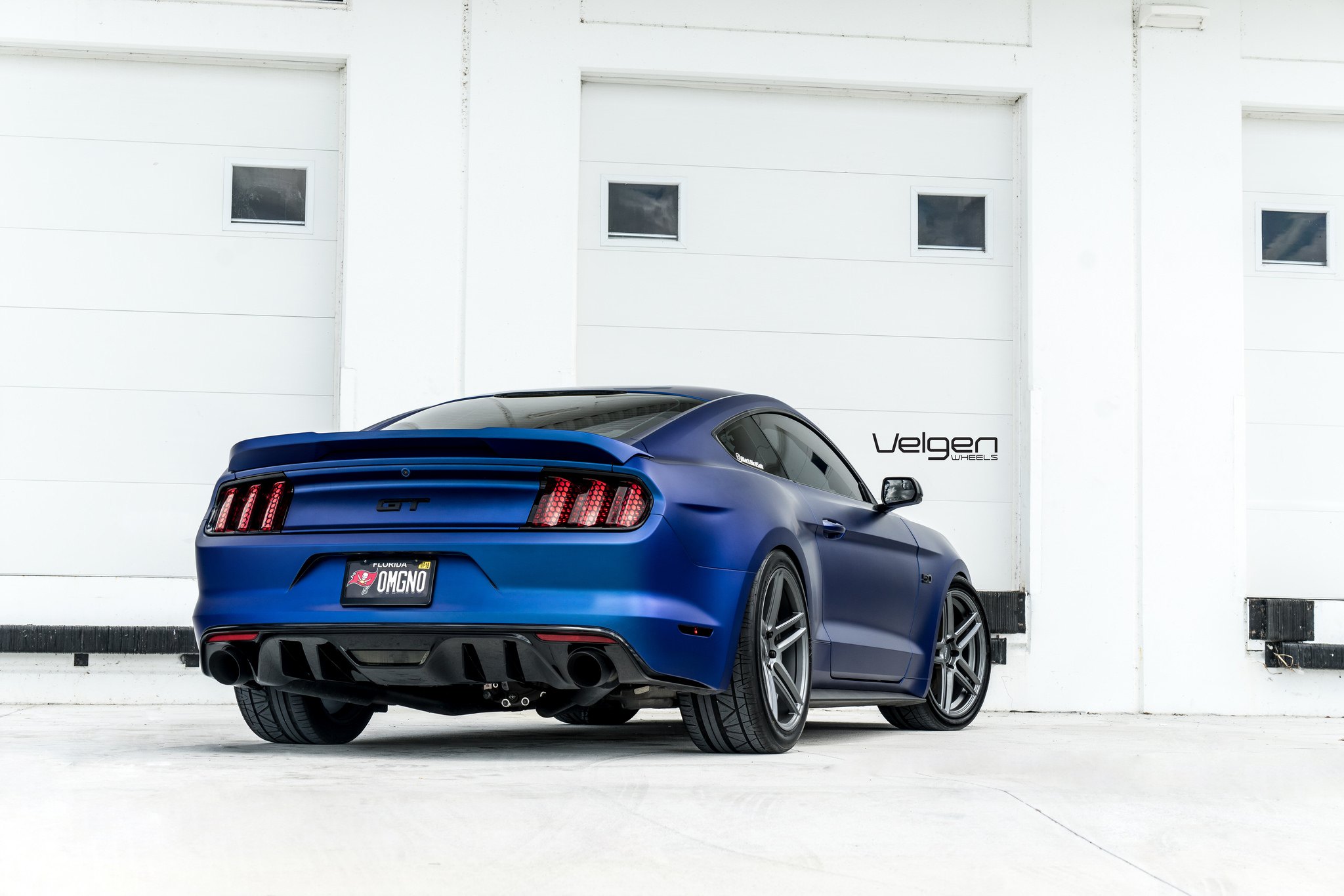 Custom Style Rear Spoiler on Blue Ford Mustang - Photo by Velgen